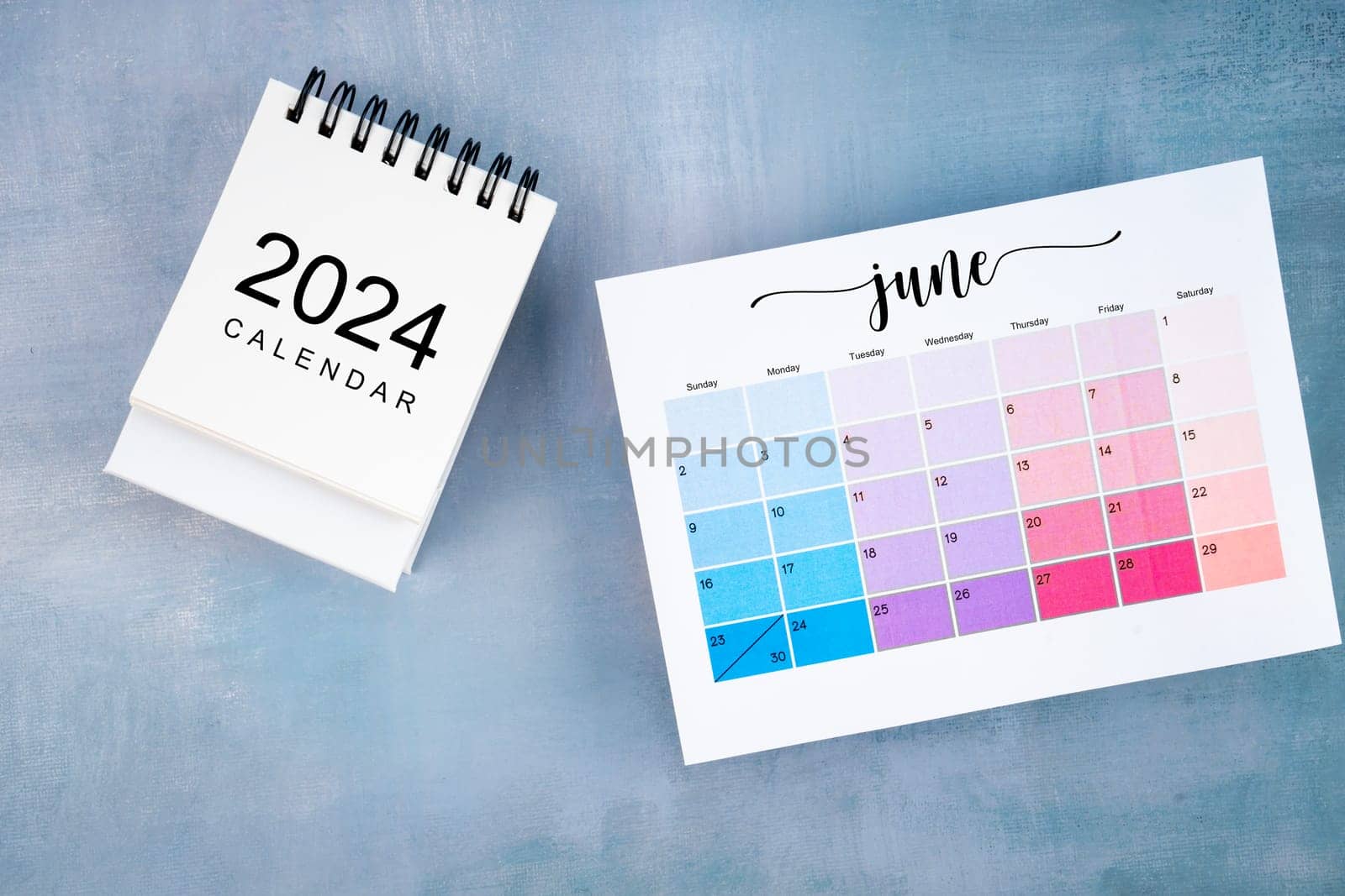 June 2024 calendar page with on wooden background. by Gamjai