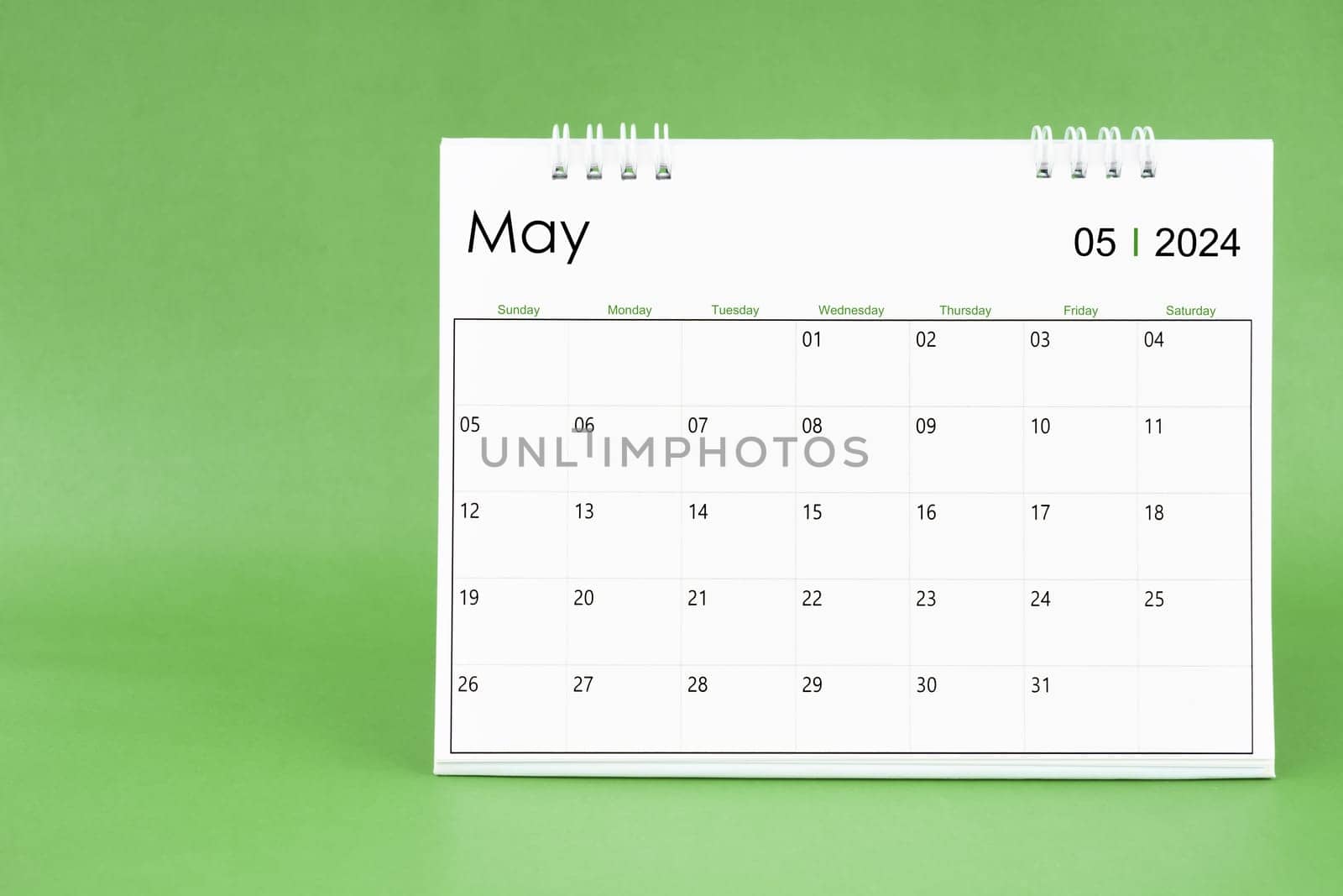 May 2024 desk calendar isolated in green background. by Gamjai