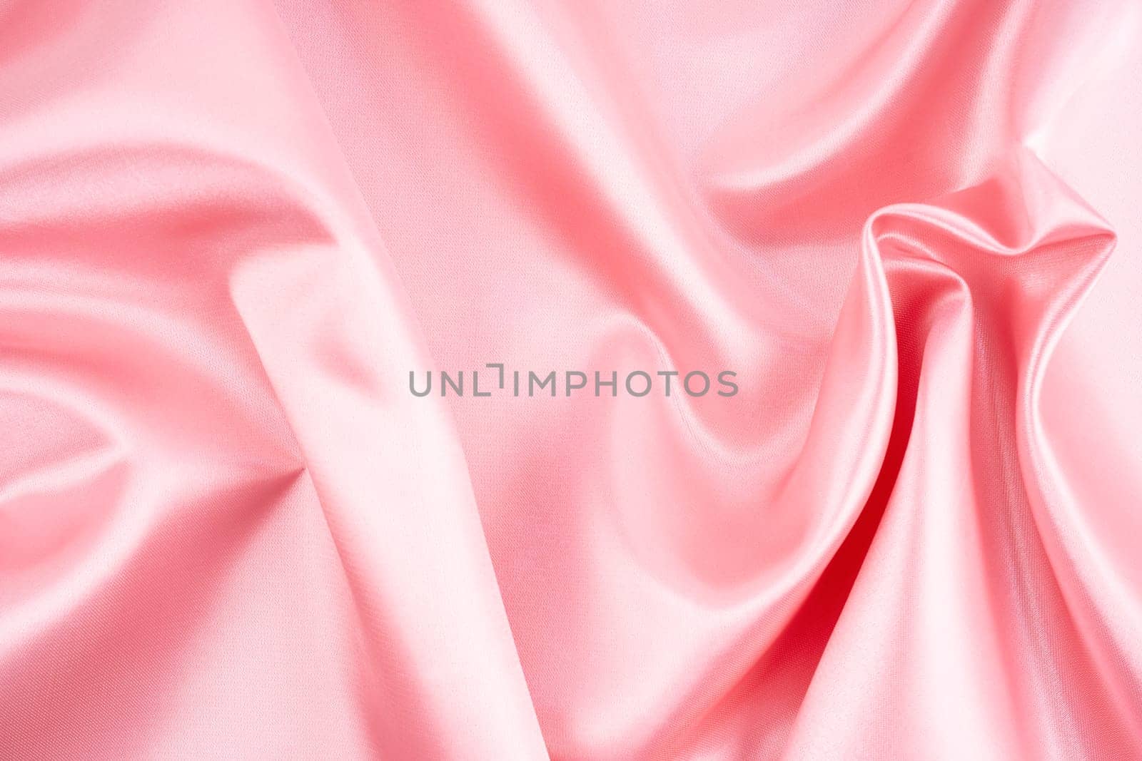 Luxury cloth wavy folds of grunge silk texture pink color. by Gamjai