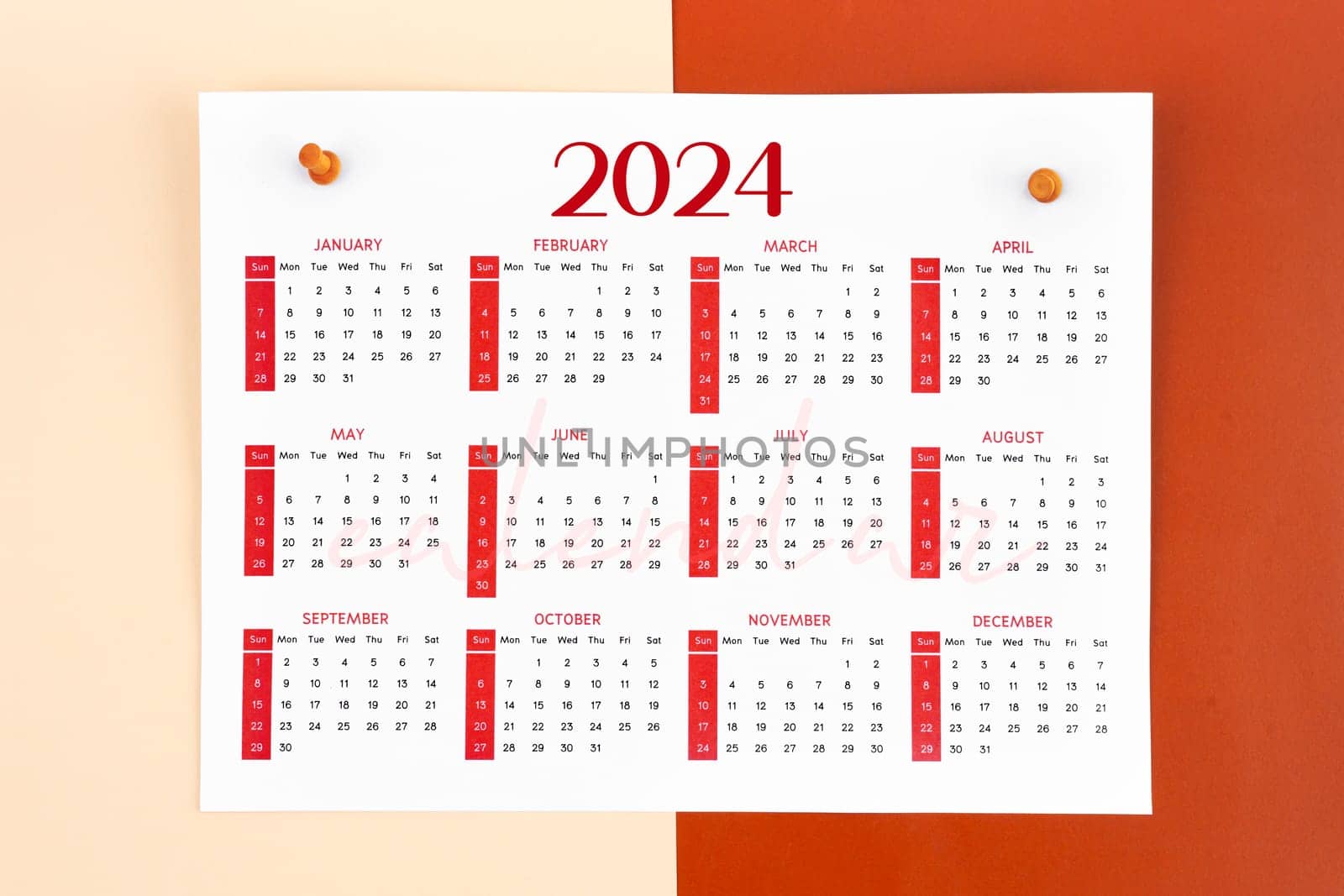 12 months calendar page for 2024 year and wooden pins. by Gamjai