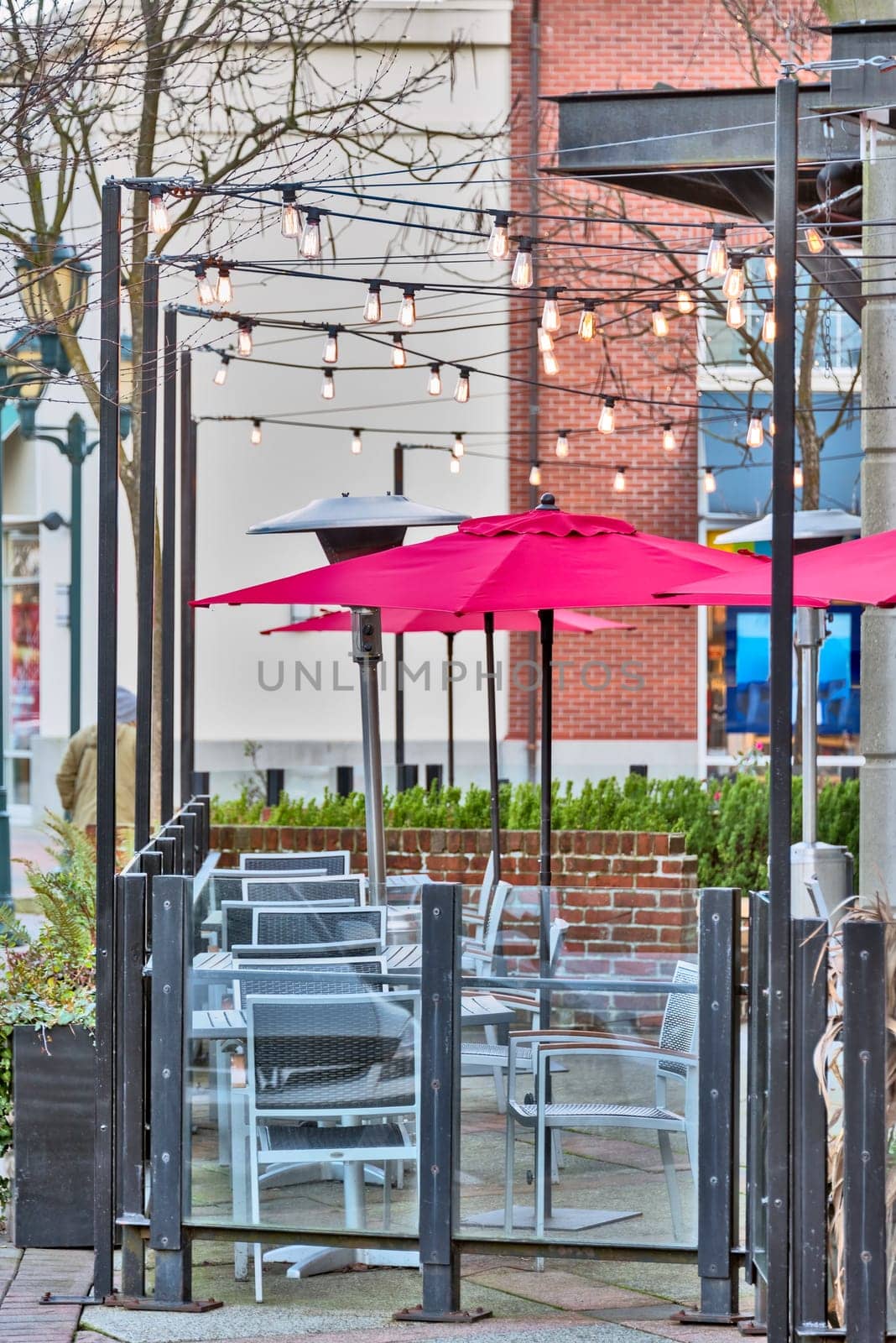 Unpopulated street cafe under red umbrellas on a winter season in Park Royal, Vancouver, Canada