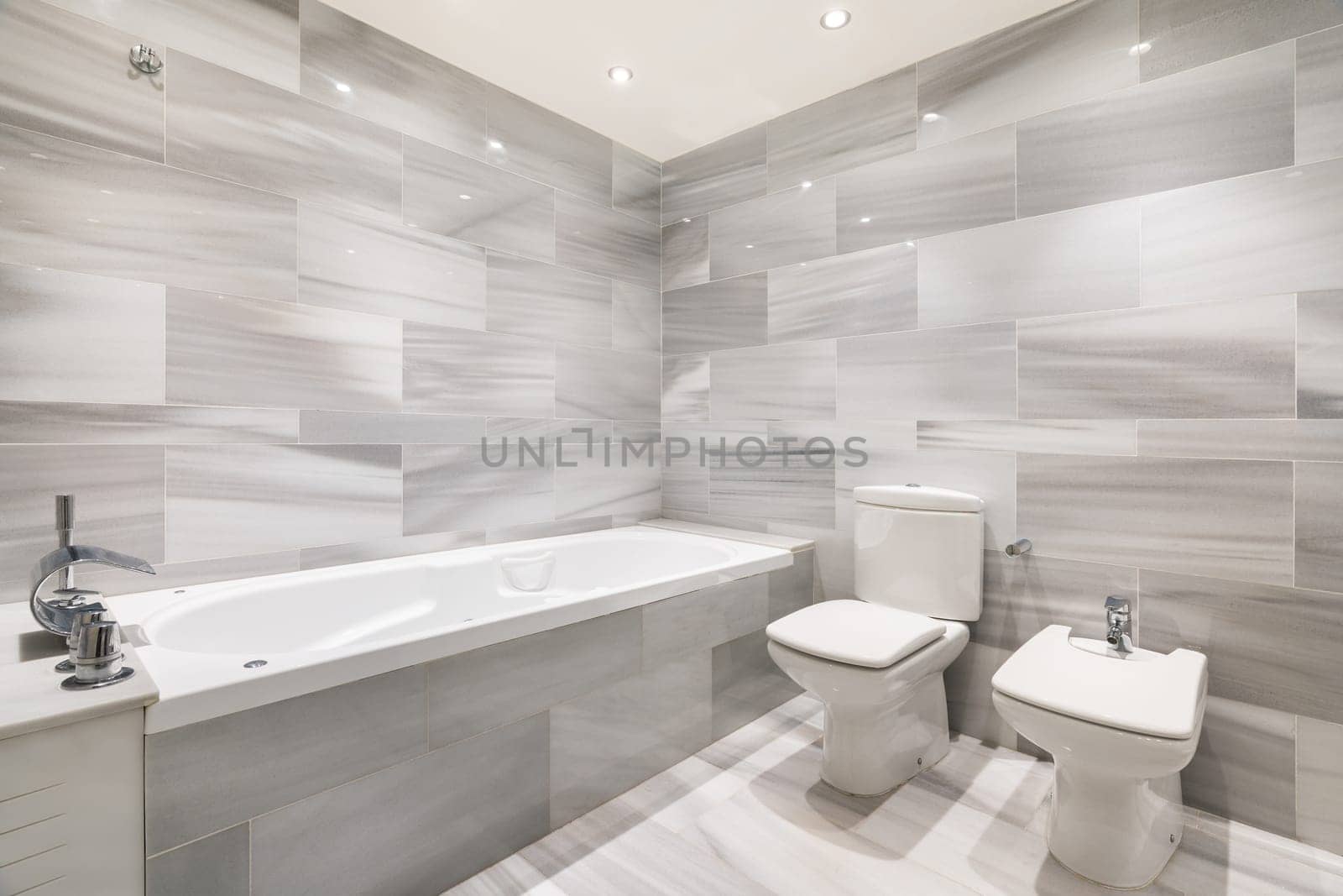 Bright room with bath toilet and bidet in apartment by apavlin