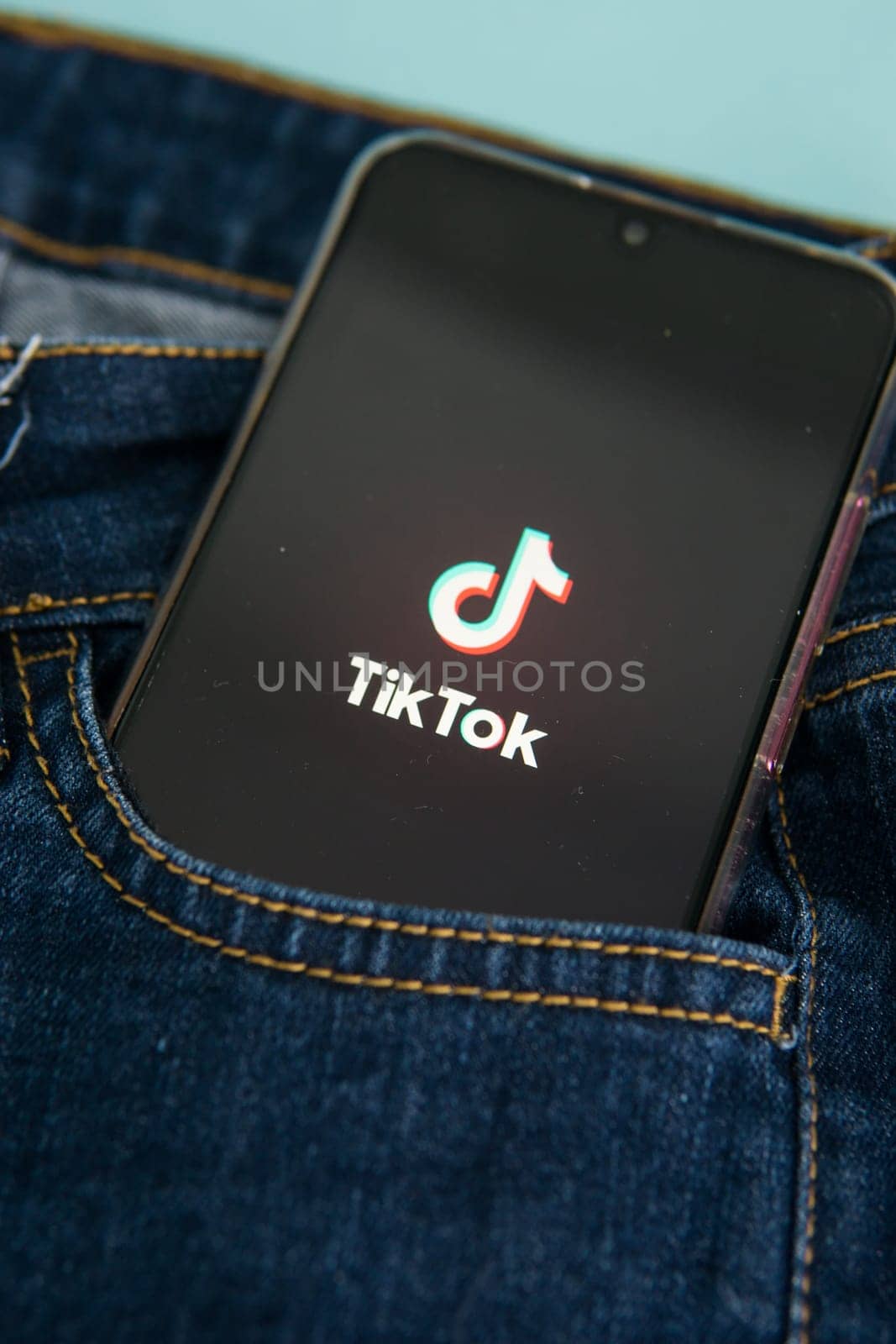 Tver, Russia-may 7, 2020, the tik tok logo on a smartphone screen sticks out of a jeans pocket. Tick-Tok icon. logo of the current app. Tiktok social network.