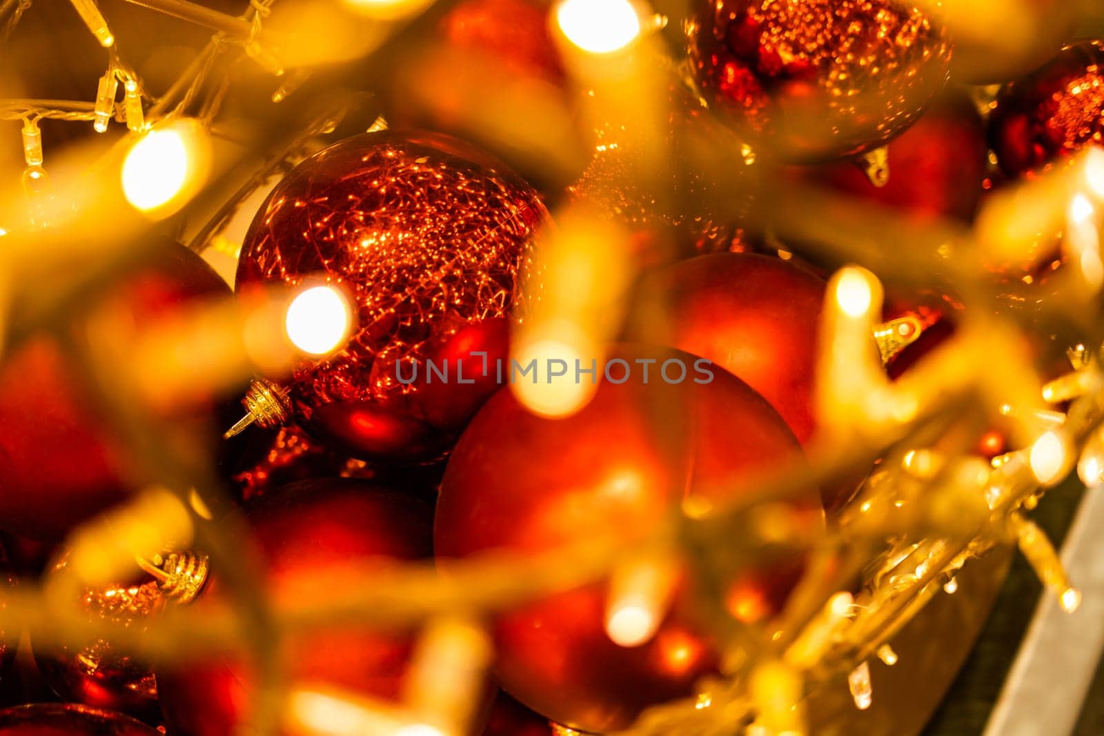 Close up of red Christmas balls baubles. Bokeh garlands. Xmas and holidays concept. Copy space and empty place for text, mock up greeting card by Satura86