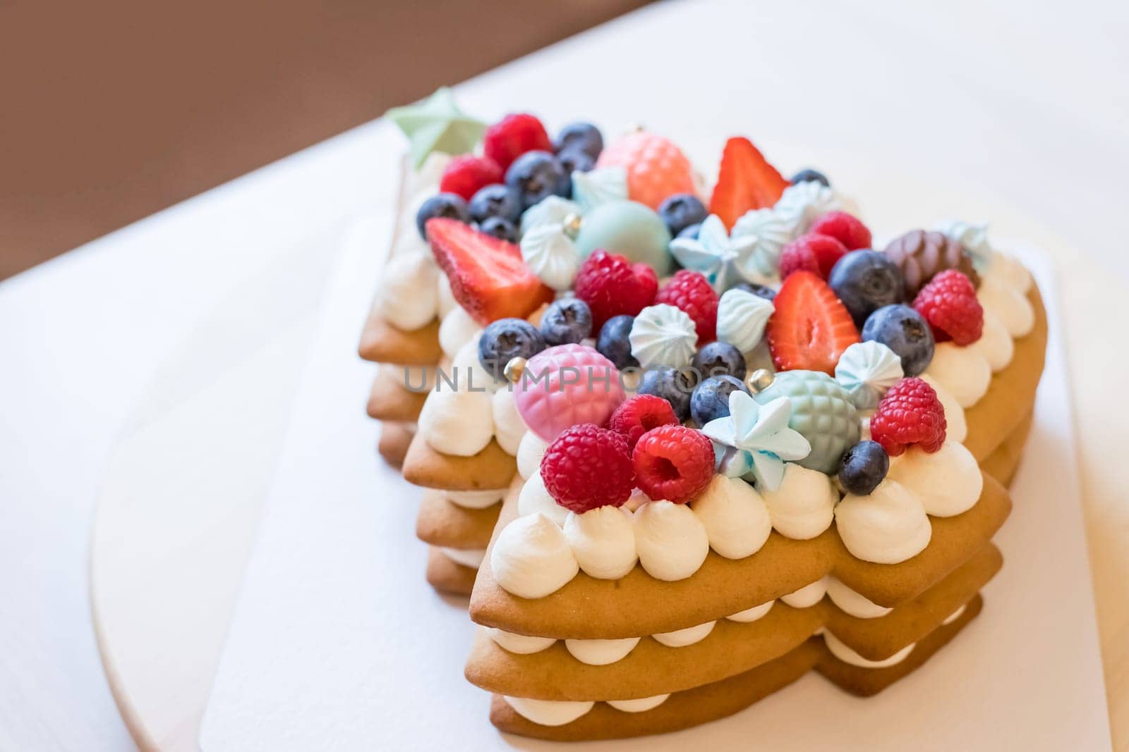 Strawberry cake, vanilla sponge cake with cream cheese and fresh strawberries. Summer cake. Selective focus