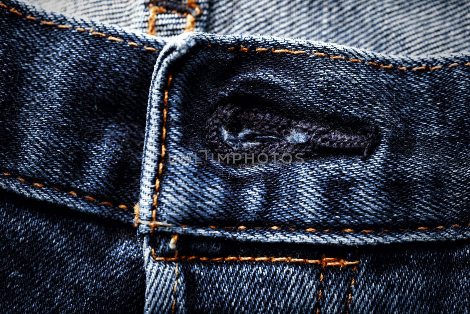Button loop on jeans. Close up of Button Loop. Denim fastener button and loop close-up by EvgeniyQW