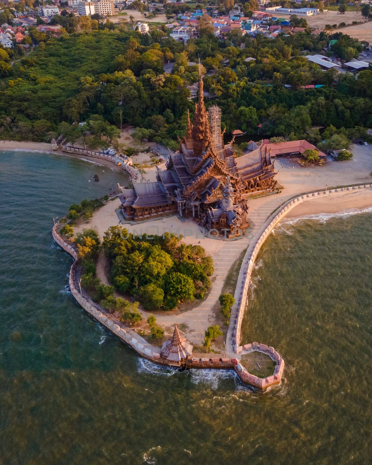 The Sanctuary of Truth wooden temple in Pattaya Thailand at sunset, wooden temple at the beach of Pattaya