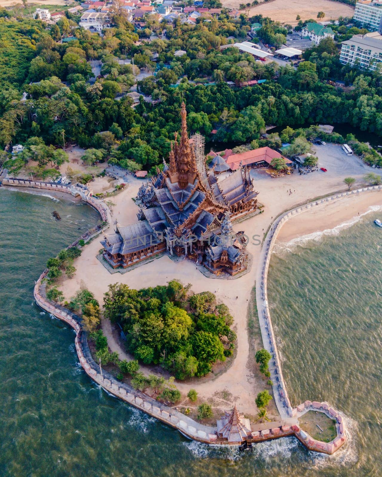 The Sanctuary of Truth wooden temple in Pattaya Thailand is a gigantic wooden construction located at the cape of Naklua Pattaya City Chonburi Thailand in the evening light