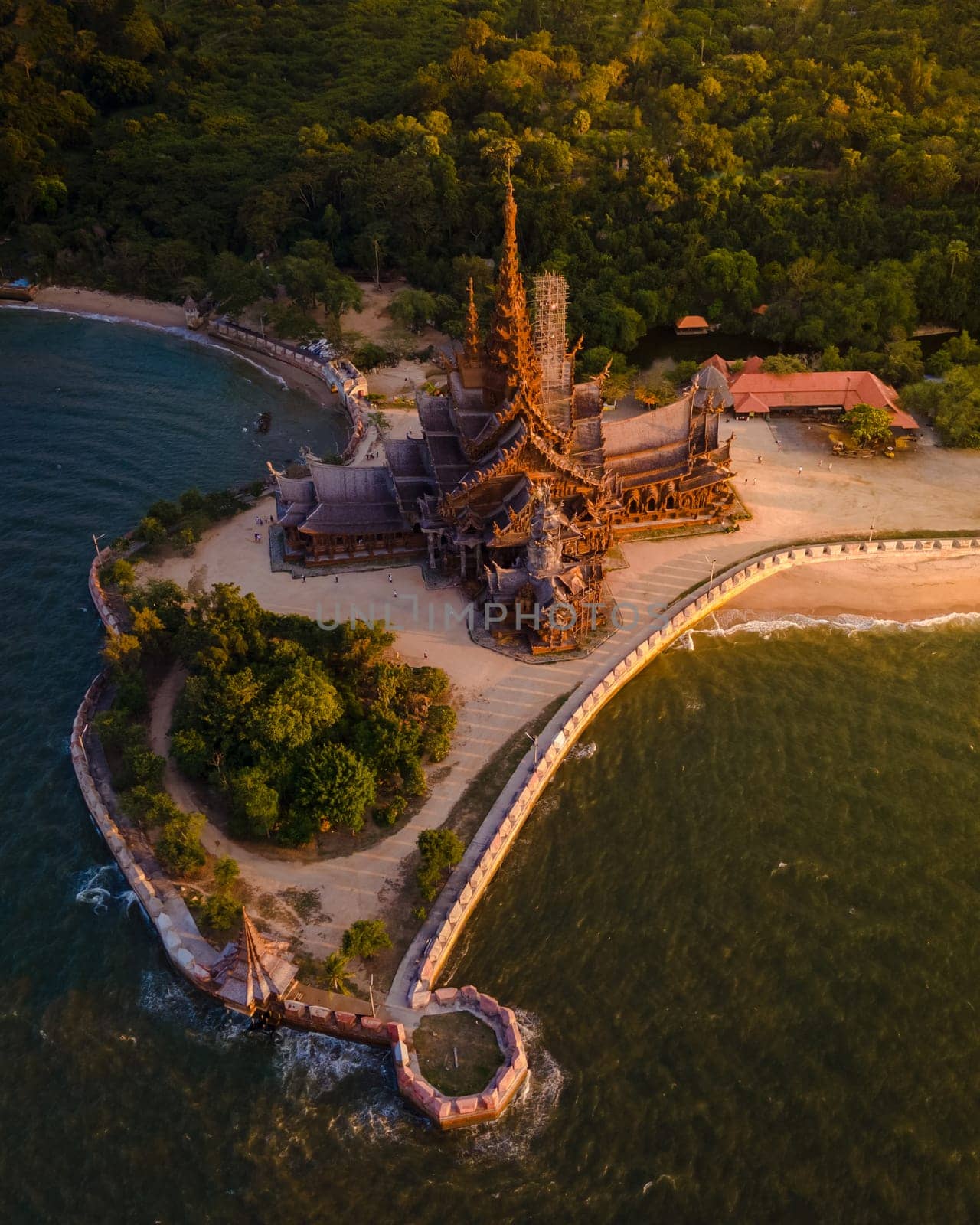 The Sanctuary of Truth wooden temple in Pattaya Thailand in the warm evening light at sunset