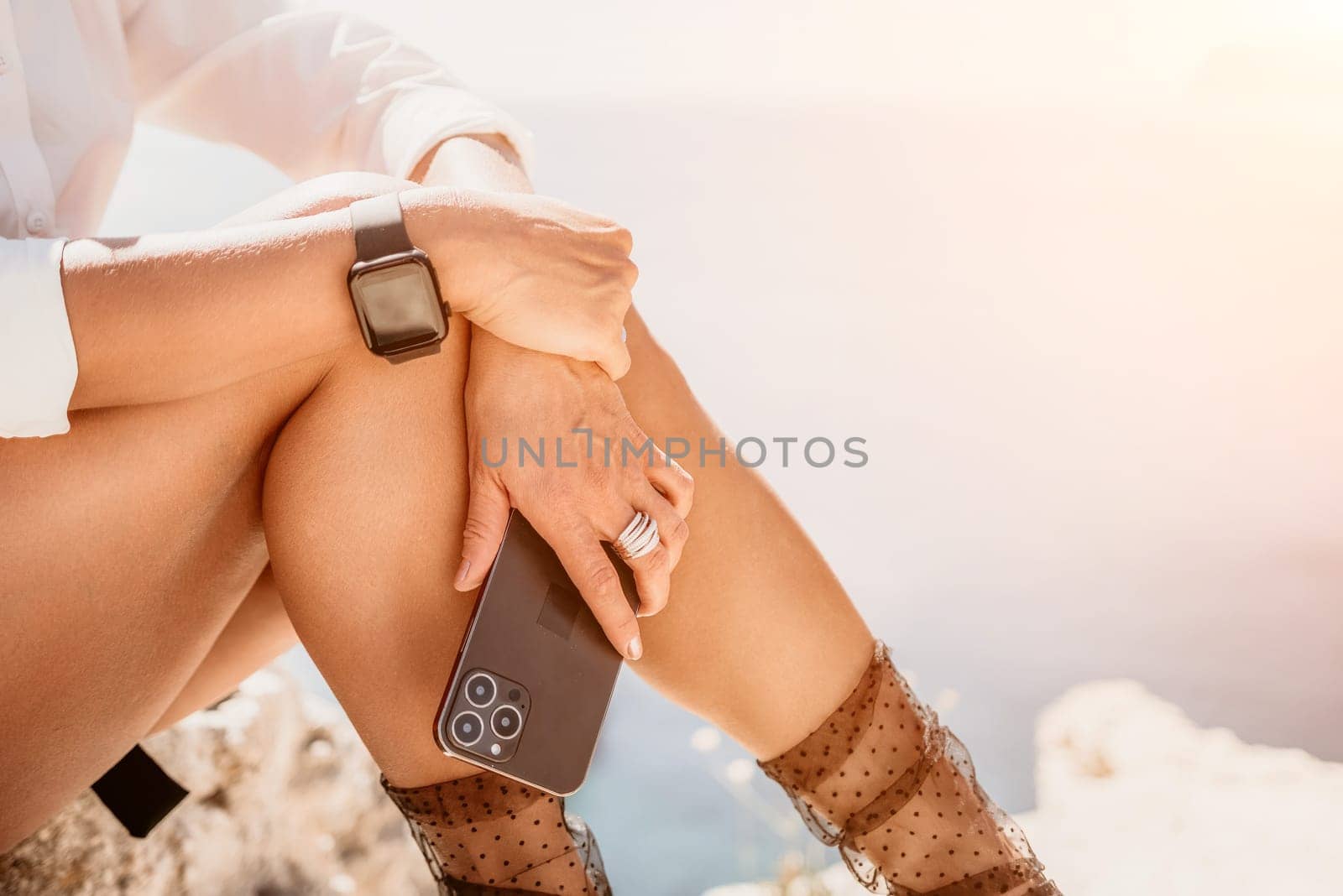 Woman sea laptop. Business woman in yellow hat freelancer with laptop working over blue sea beach. Girl relieves stress from work. Freelance, digital nomad, travel and holidays concept by panophotograph