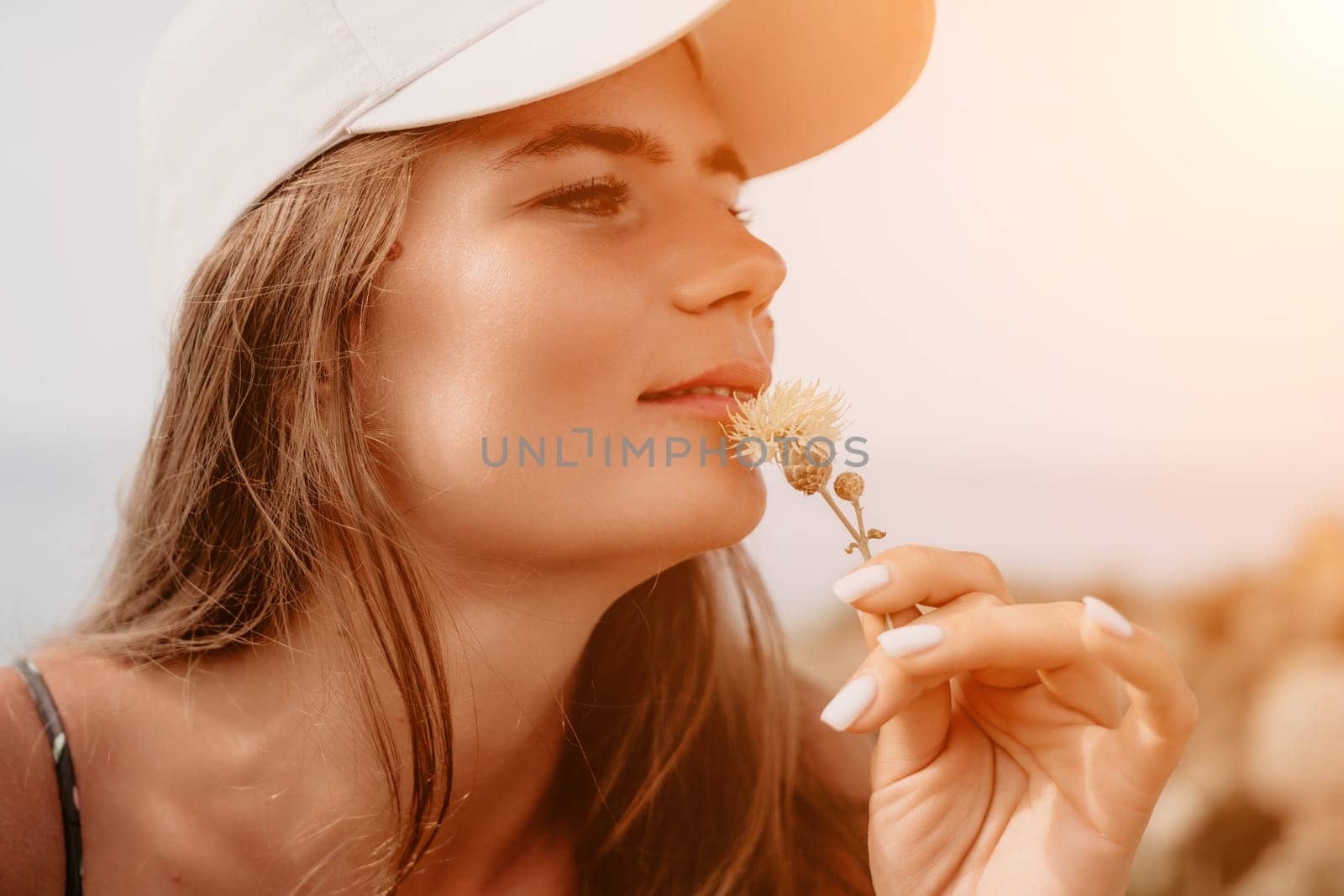 Woman travel sea. Happy tourist taking picture outdoors for memories. Woman traveler looks at the edge of the cliff on the sea bay of mountains, sharing travel adventure journey by panophotograph