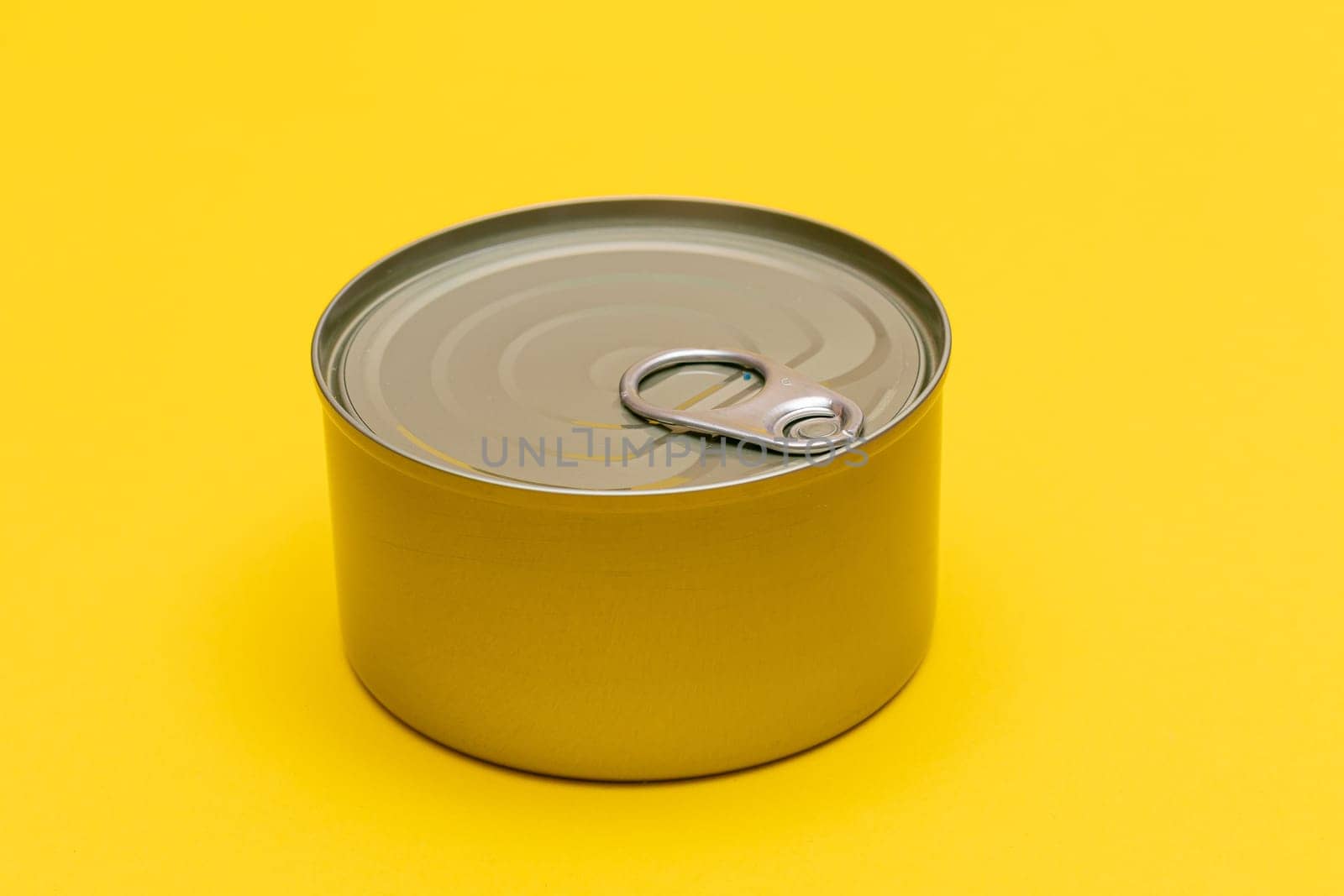 Unopened Tin Can with Blank Edge on Yellow Background by InfinitumProdux