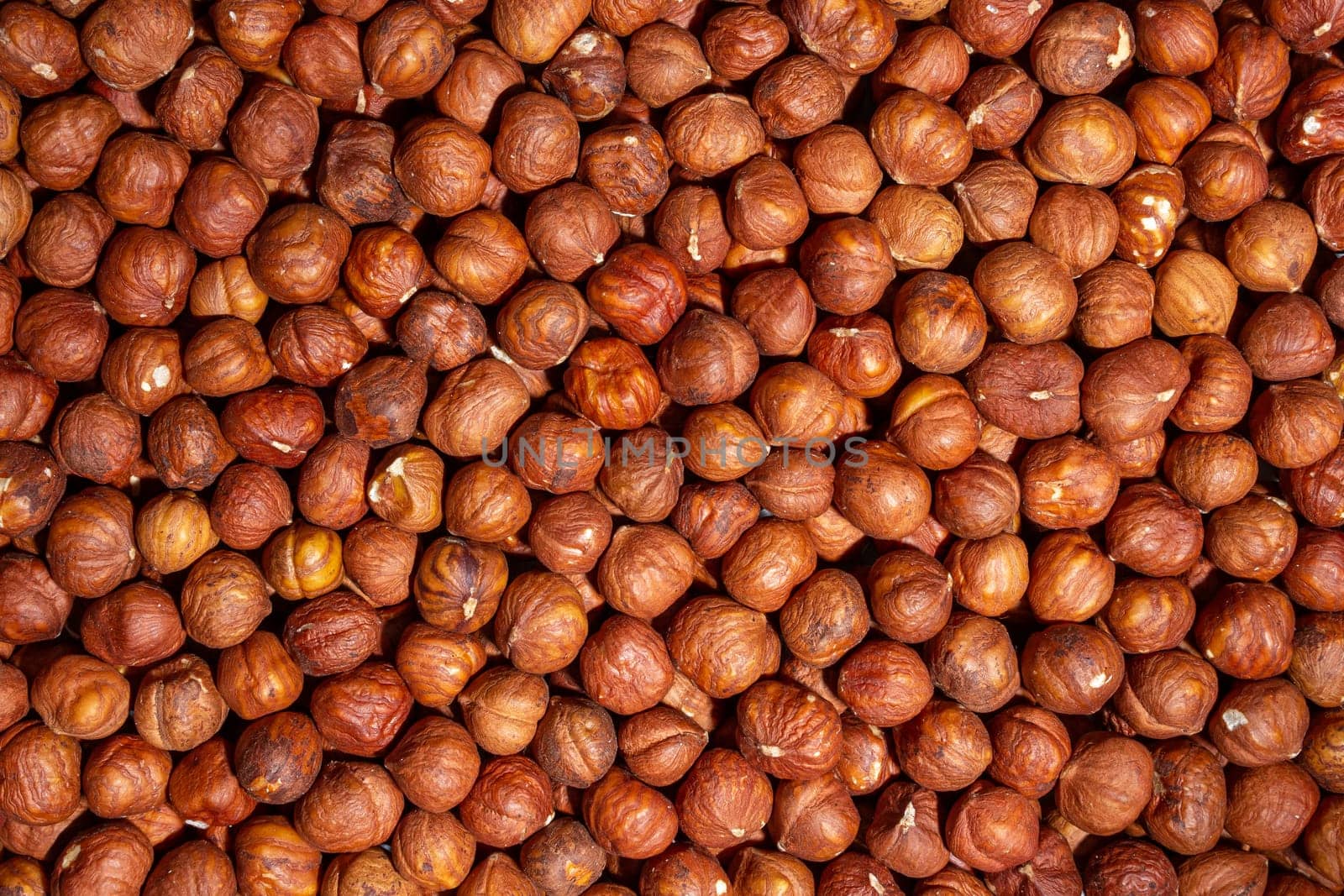 Scattered Peeled Hazelnut. Background from Hazelnuts by InfinitumProdux