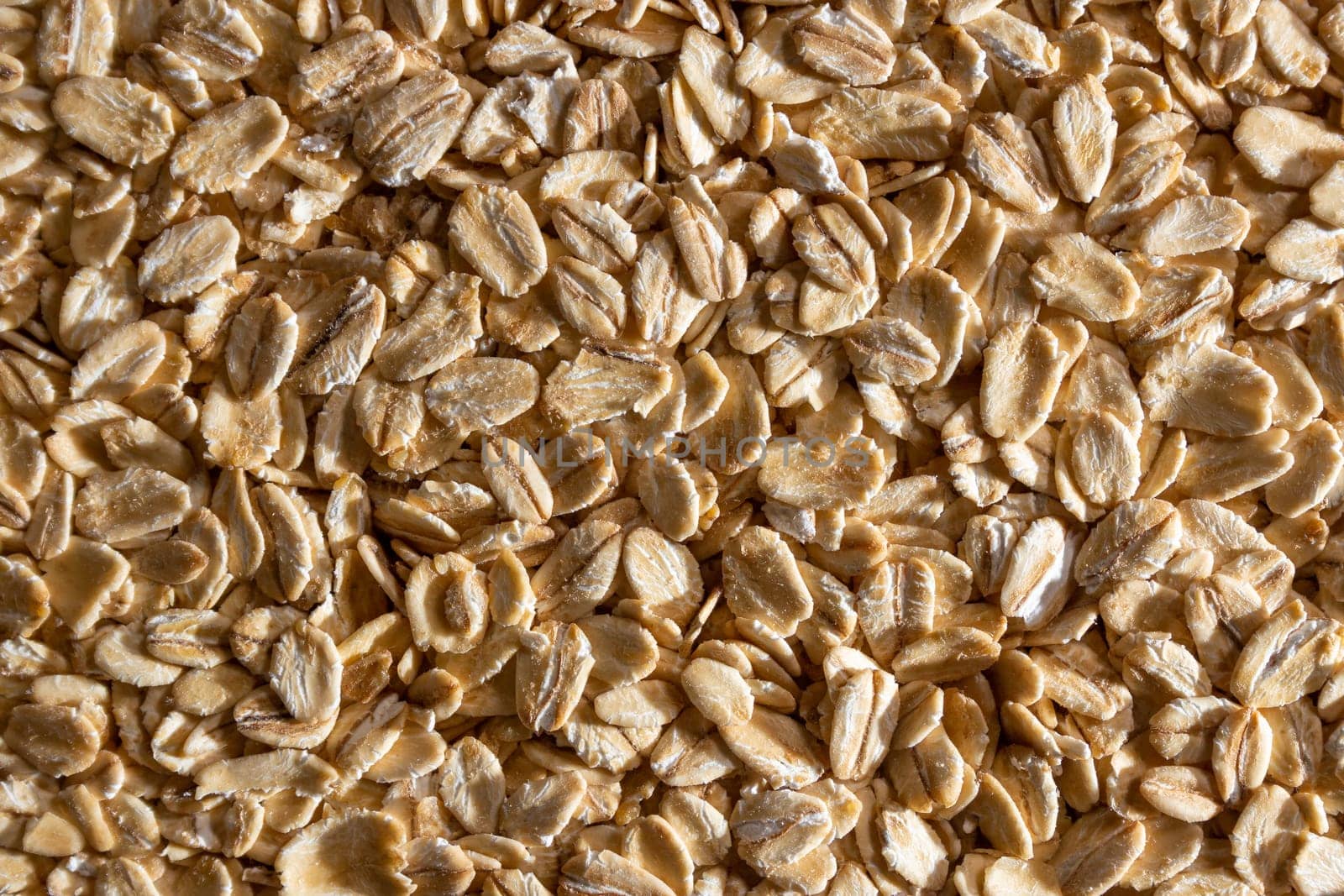 Dry Uncooked Oat Flakes background by InfinitumProdux