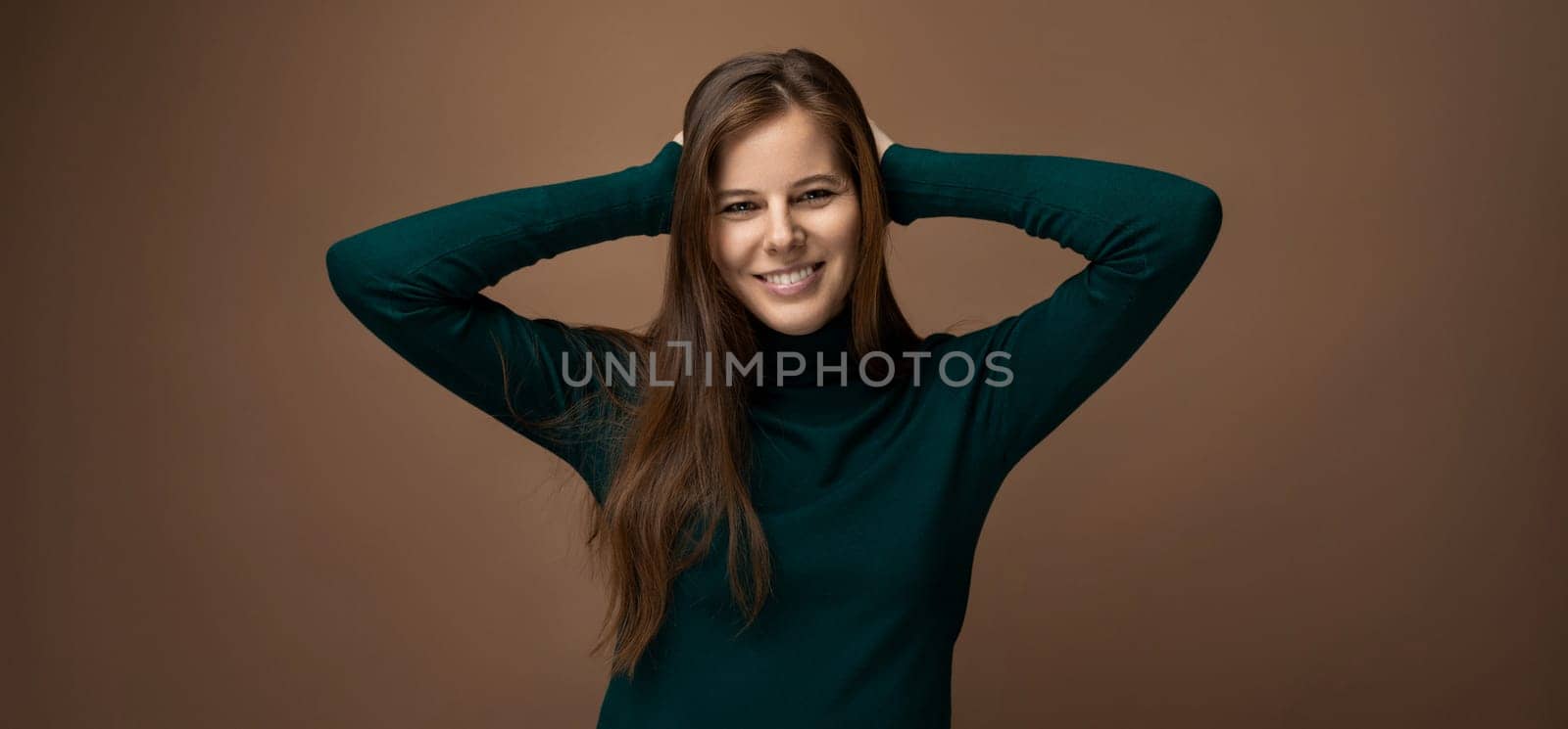 Headshot portrait of a young European woman with brown hair in a casual look by TRMK