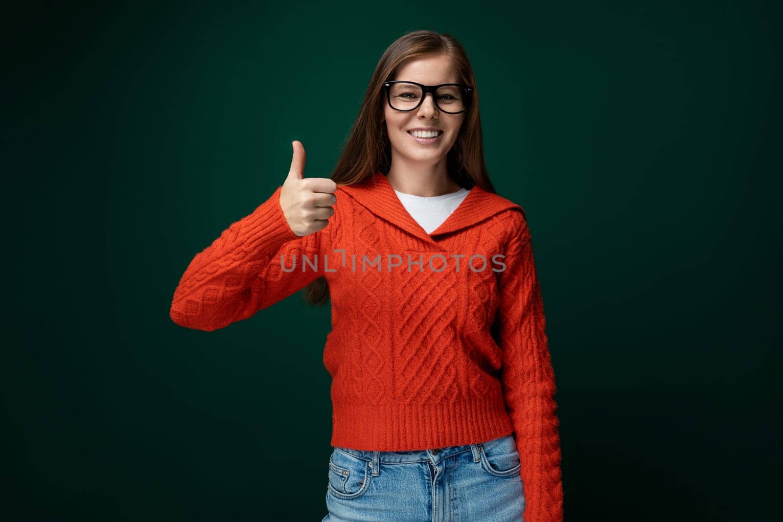 Smart Caucasian woman with brown straight hair and glasses on green background by TRMK