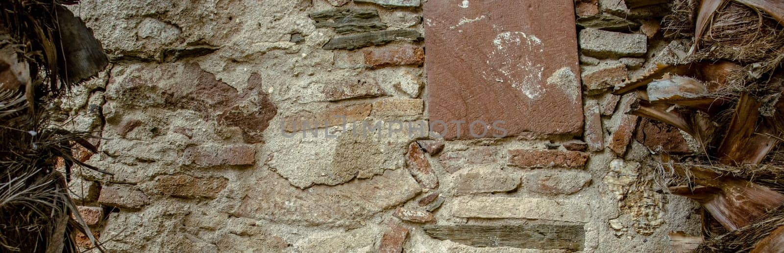 Close up old gray brick texture wall concept photo. Medieval architecture, backyard with palm trees by _Nataly_Nati_