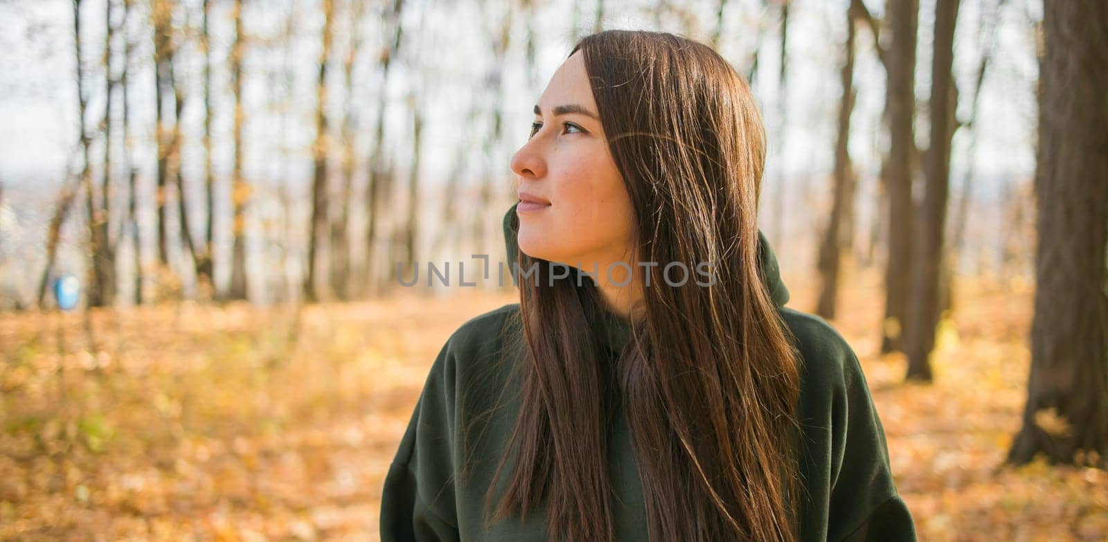 Banner millennial smiling woman walking outdoors in autumn nature with empty place for advertising text, Fall season copy space and mock up by Satura86