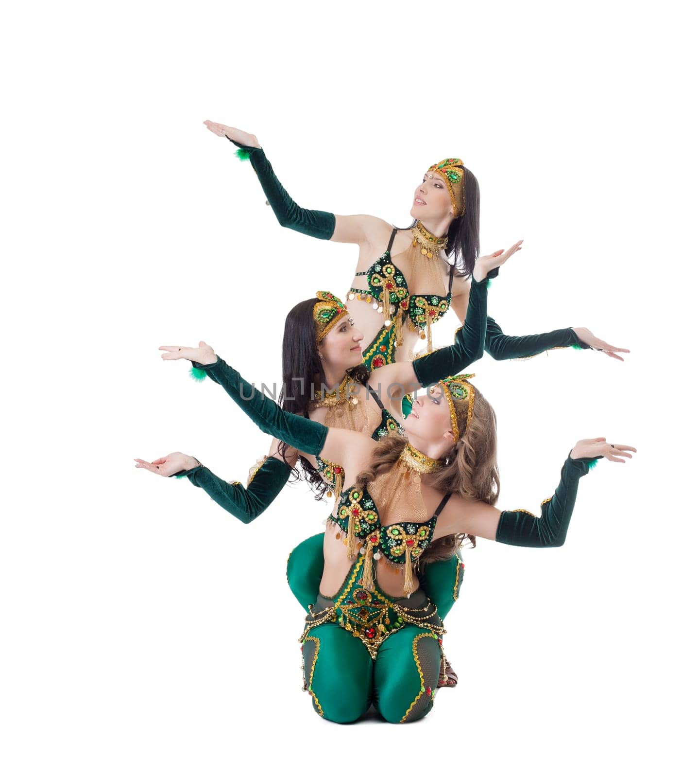 Oriental dancers posing at camera, isolated on white background