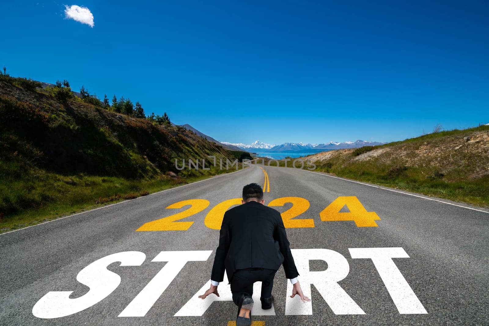 2024 New Year journey and future vision concept . Businessman traveling on highway road leading forward to happy new year celebration in beginning of 2024 for bliss and successful start .