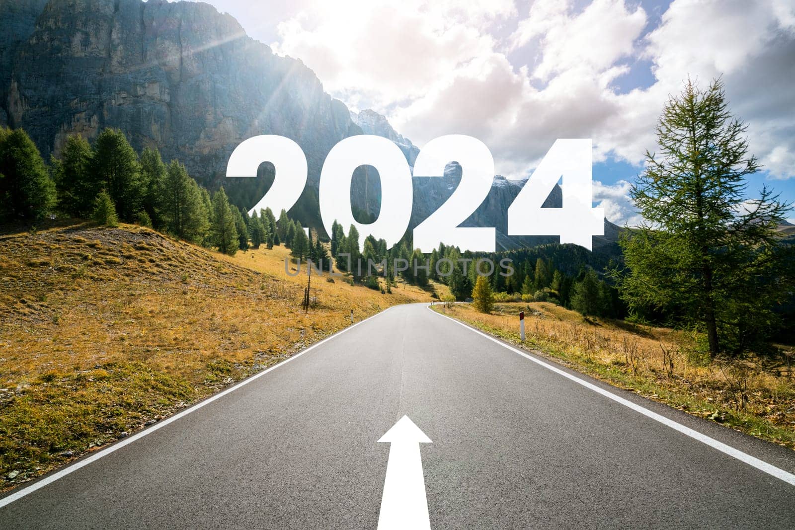 2024 New Year road trip travel and future vision concept . Nature landscape with highway road leading forward to happy new year celebration in the beginning of 2024 for bliss and successful start .