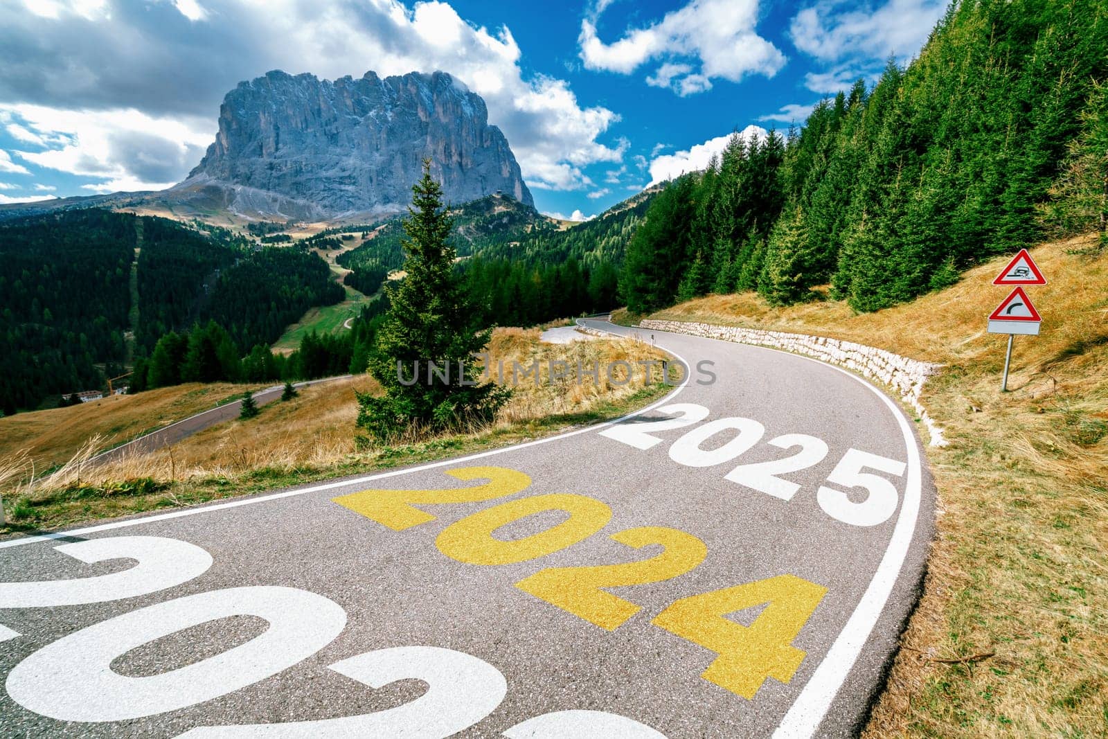 2024 New Year road trip travel and future vision concept . Nature landscape with highway road leading forward to happy new year celebration in the beginning of 2024 for bliss and successful start .