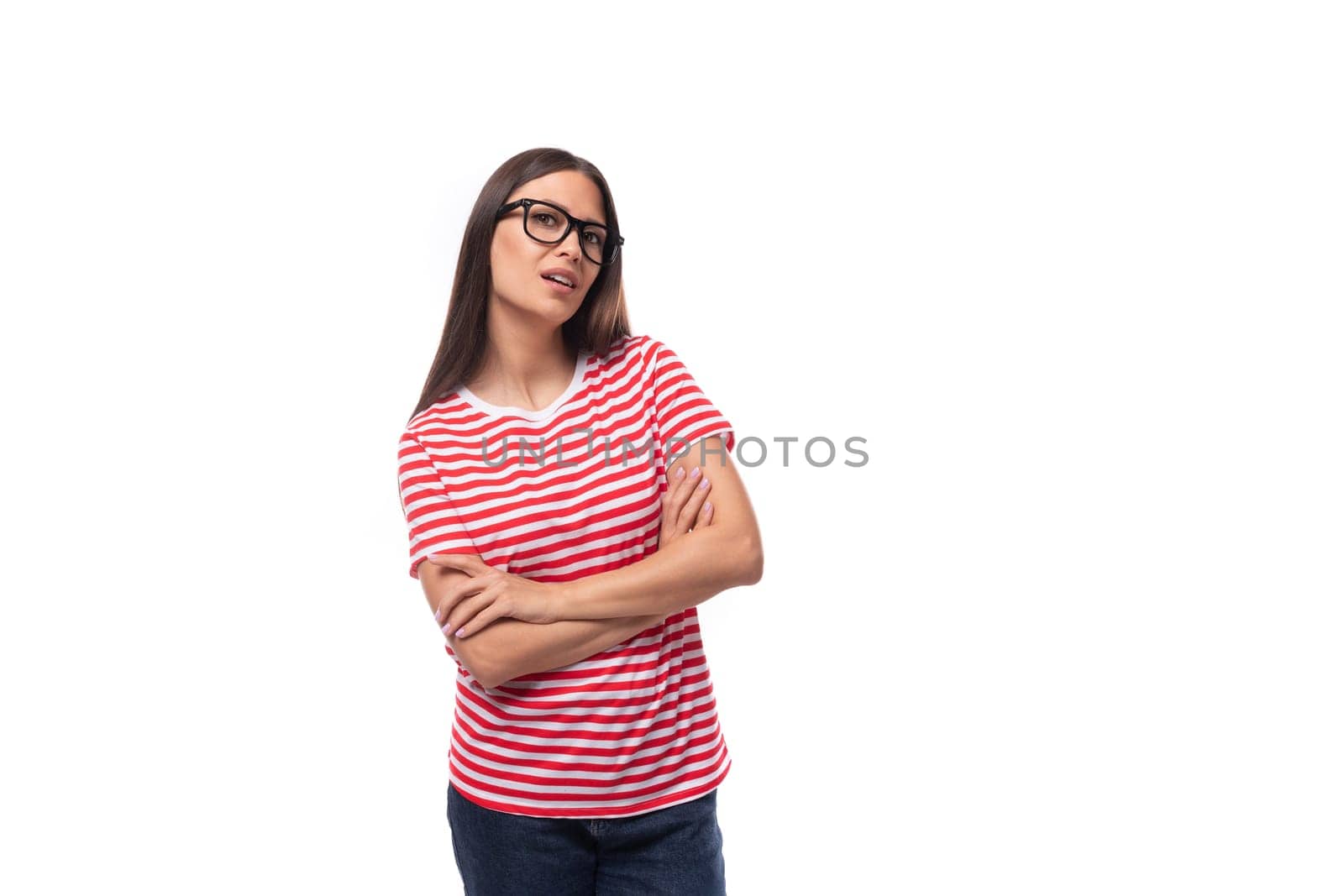 portrait of a young well-groomed european woman with straight black hair in glasses on a white background with copy space.