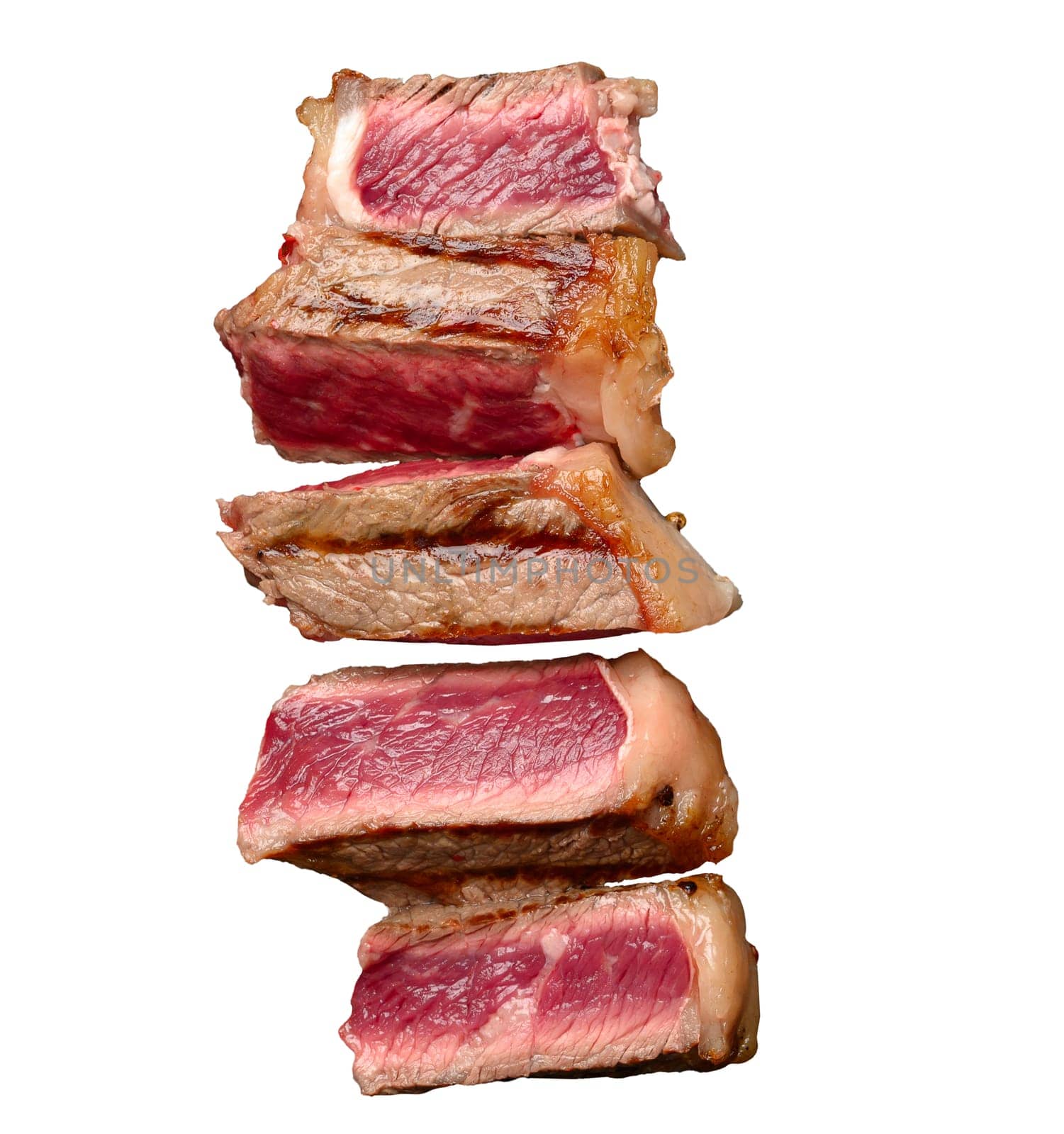 Sliced fried beef steak New York on a isolated background, degree of doneness rare by ndanko