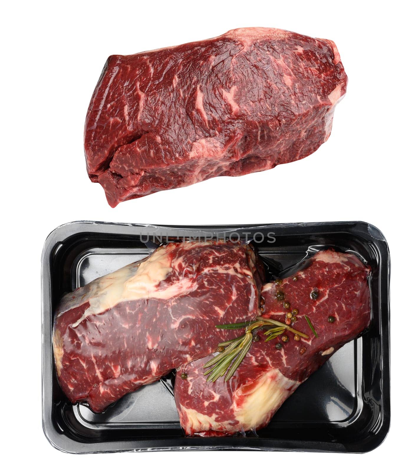 Two raw beef steaks in a plastic container with spices and vacuumized on a white background, packaging for long-term storage by ndanko