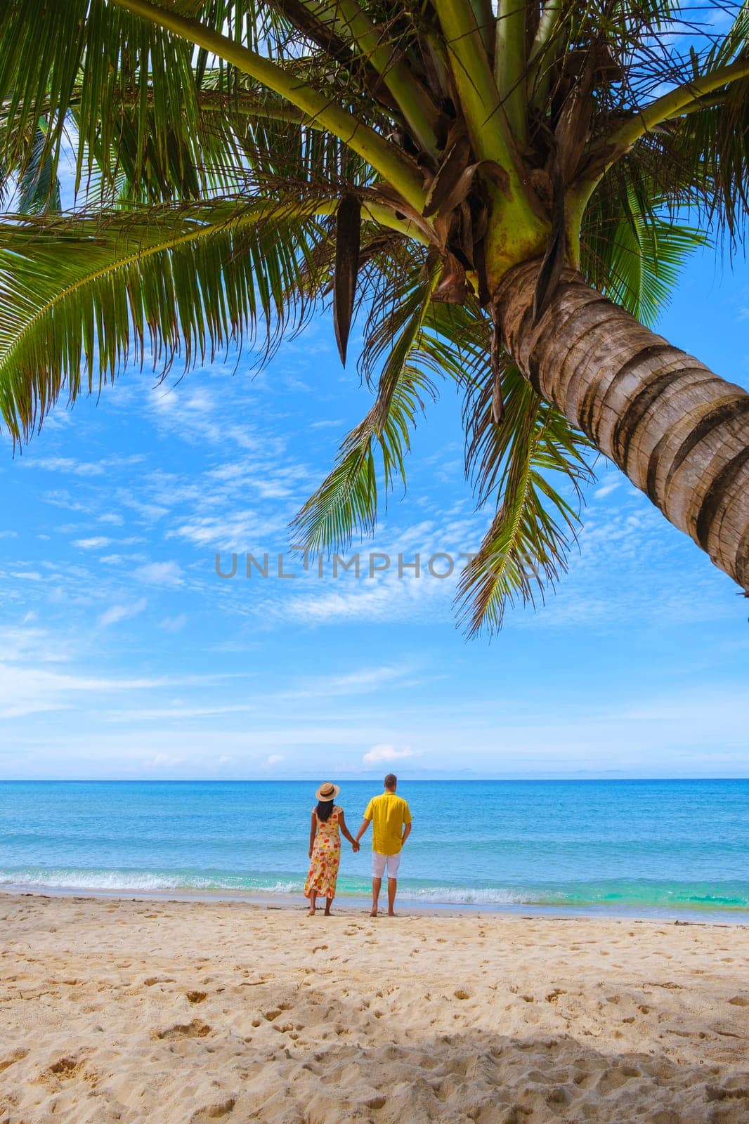 Tropical Island Koh Kood or Koh Kut Thailand. Couple men and women on vacation in Thailand walking at the beach, holiday concept Island hopping in Eastern Thailand Trang