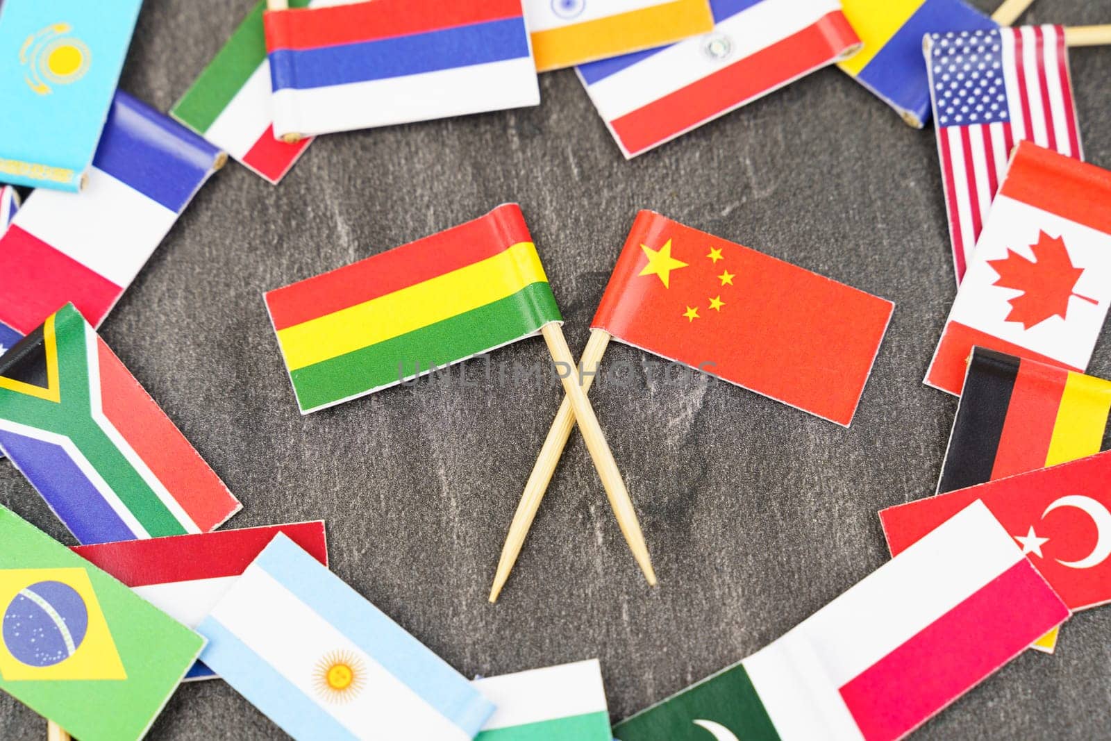 Policy. National flags of different countries. The concept is diplomacy. In the middle among the various flags are two flags - China, Lithuania