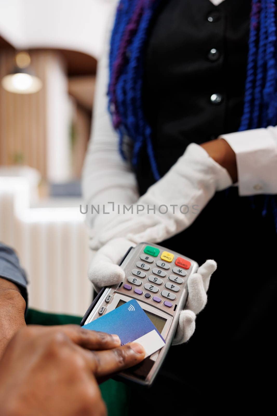 Man using contactless credit card to pay by DCStudio