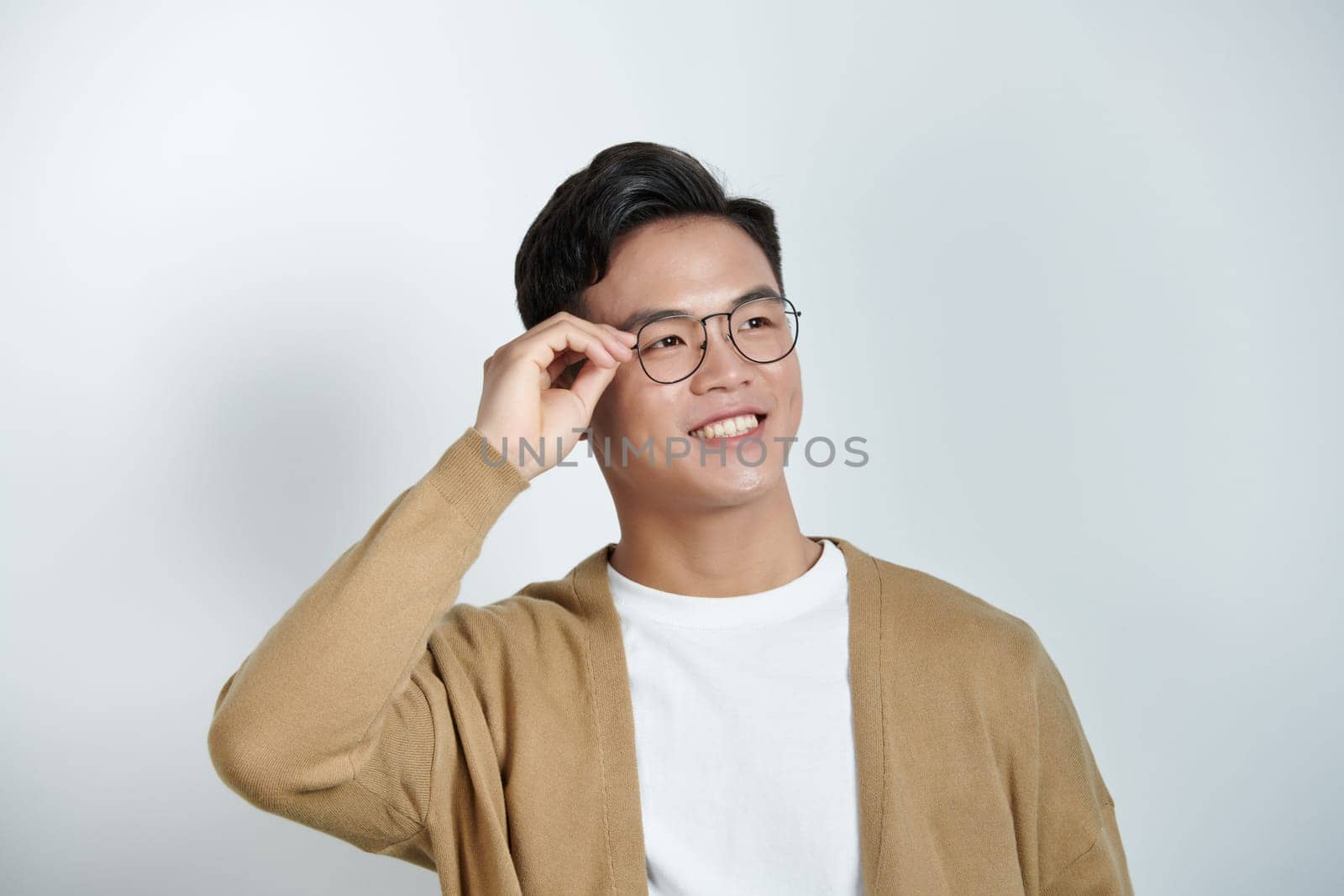 Photo of smart positive person arm touch adjust fixing eyewear isolated on red background