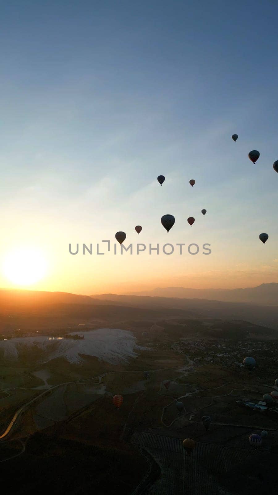 Amazing Aerial Footage of Hot Air Balloons in Pamukkale during the sunrise. High quality photo