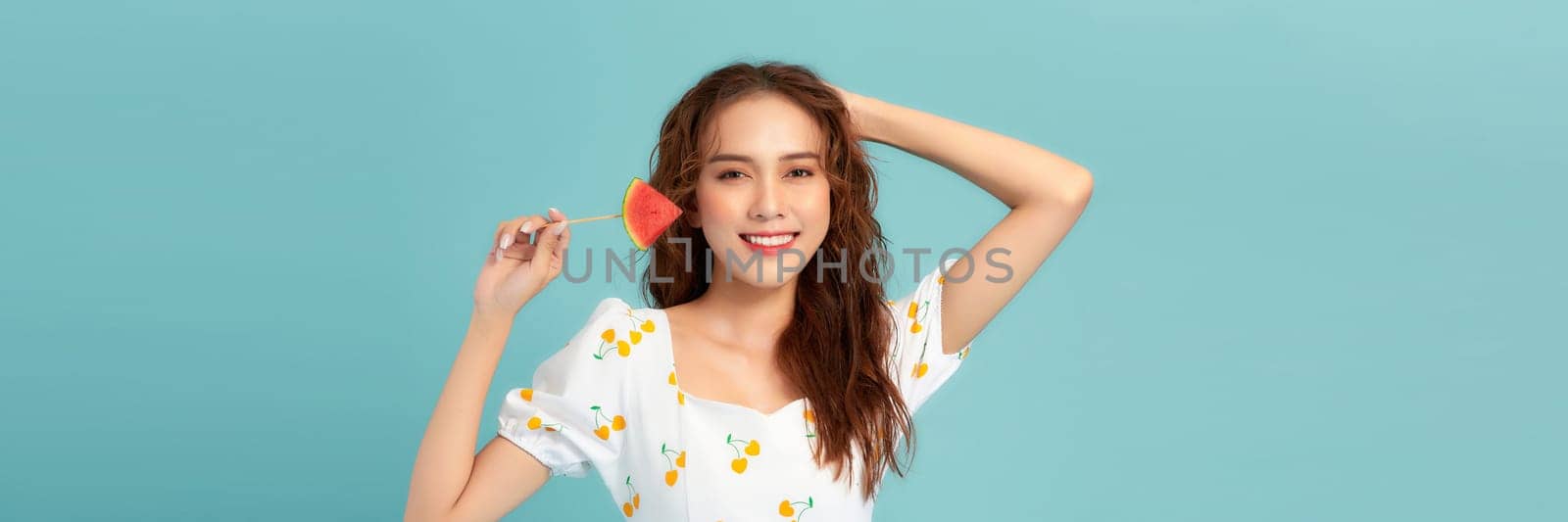 Photo of pretty cheerful girl hold fresh watermelon toothy smile isolated on blue banner background