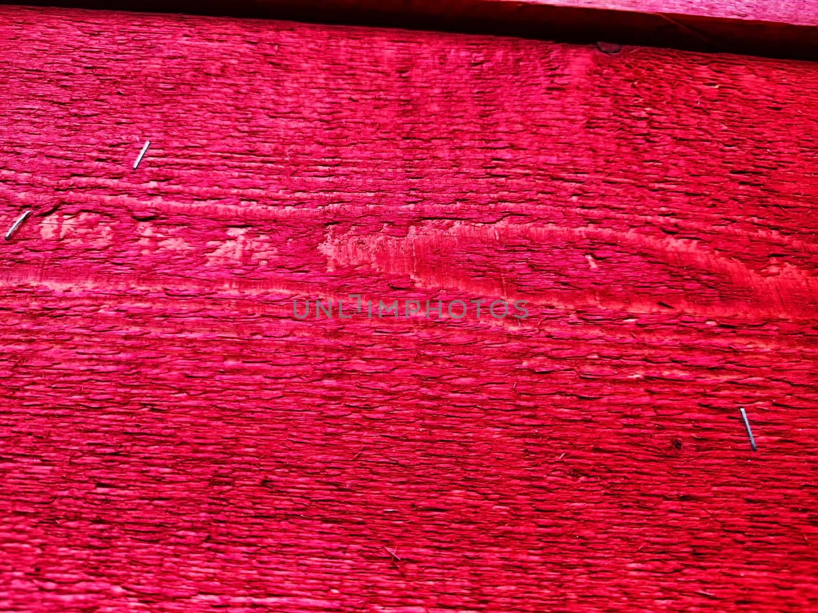 Abstract background with old wooden boards painted with red paint with texture and knots. Pattern, place for text and copy space by keleny