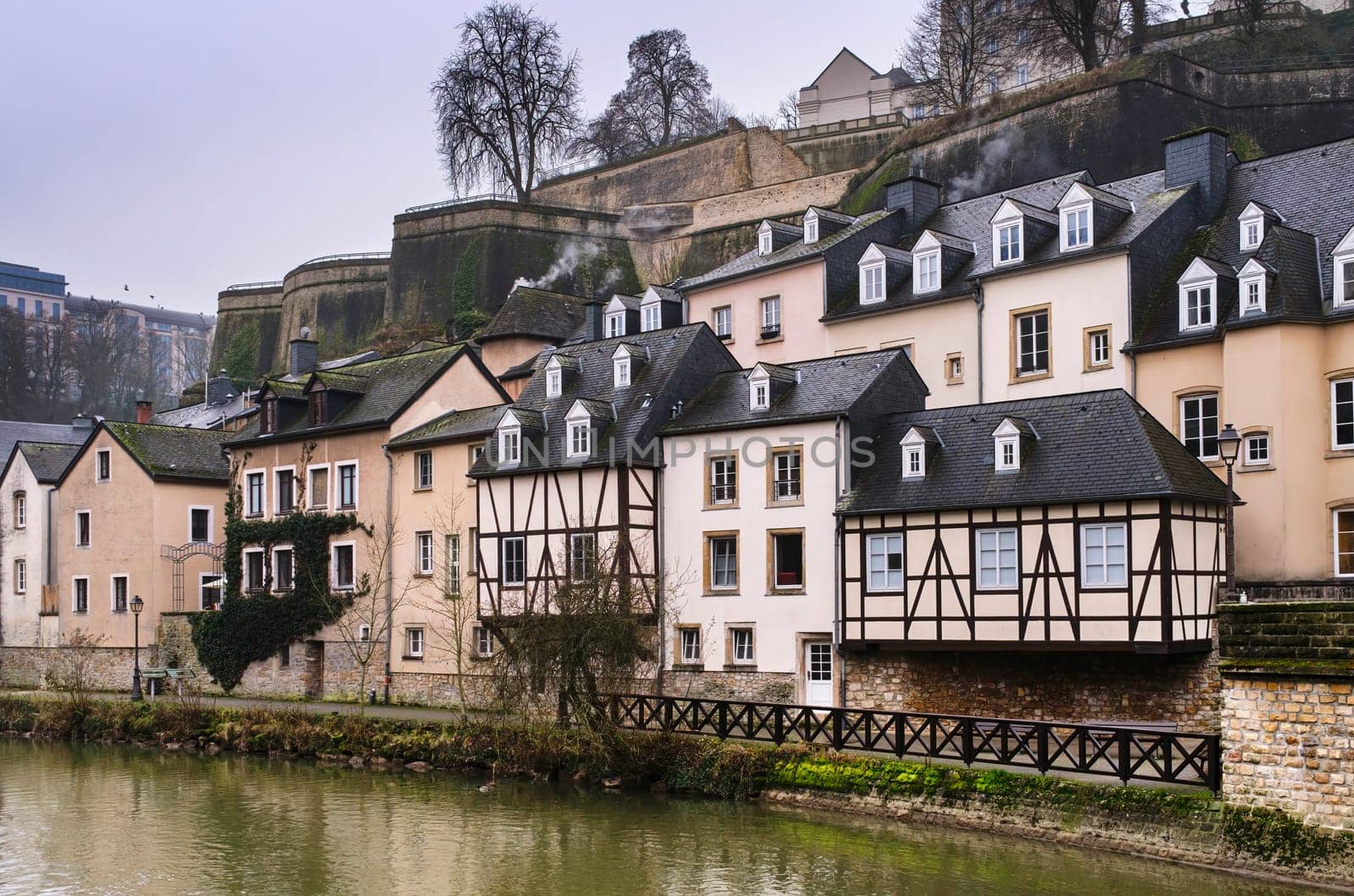 Traditional houses in the district of the Grund in the city of Luxemburg, on the banks of the Alzette river with winter atmosphere.