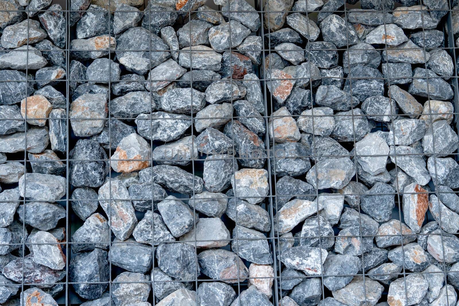 The layer of rock or stone are set up as the wall in some building or factory.