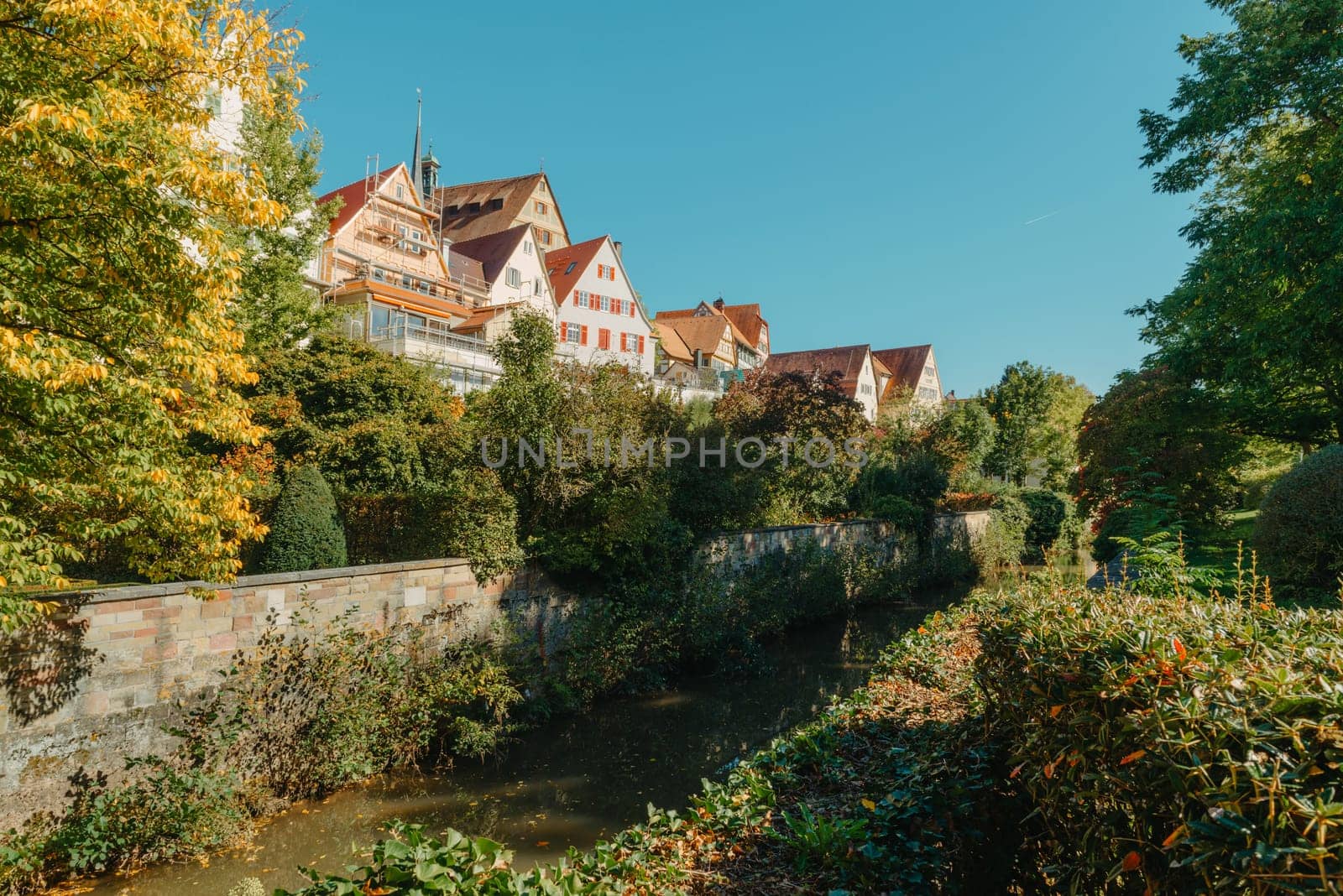 Old national German town house. Old Town is full of colorful and well preserved buildings. Baden-Wurttemberg is a state in southwest Germany bordering France and Switzerland. The Black Forest, known for its evergreen scenery and traditional villages, lies in the mountainous southwest. Stuttgart, the capital, is home to Wilhelma, a royal estate turned zoo and gardens. Porsche and Mercedes-Benz have headquarters and museums there. The 19th-century Hohenzollern Castle sits in the Swabian Alps to the south.