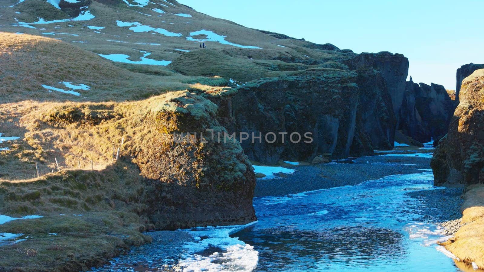 Fjadrargljufur canyon in iceland, beautiful green natural scenery with river stream and rocks. Fantastic landscape and icelandic nature on scandinavian hills. Handheld shot.