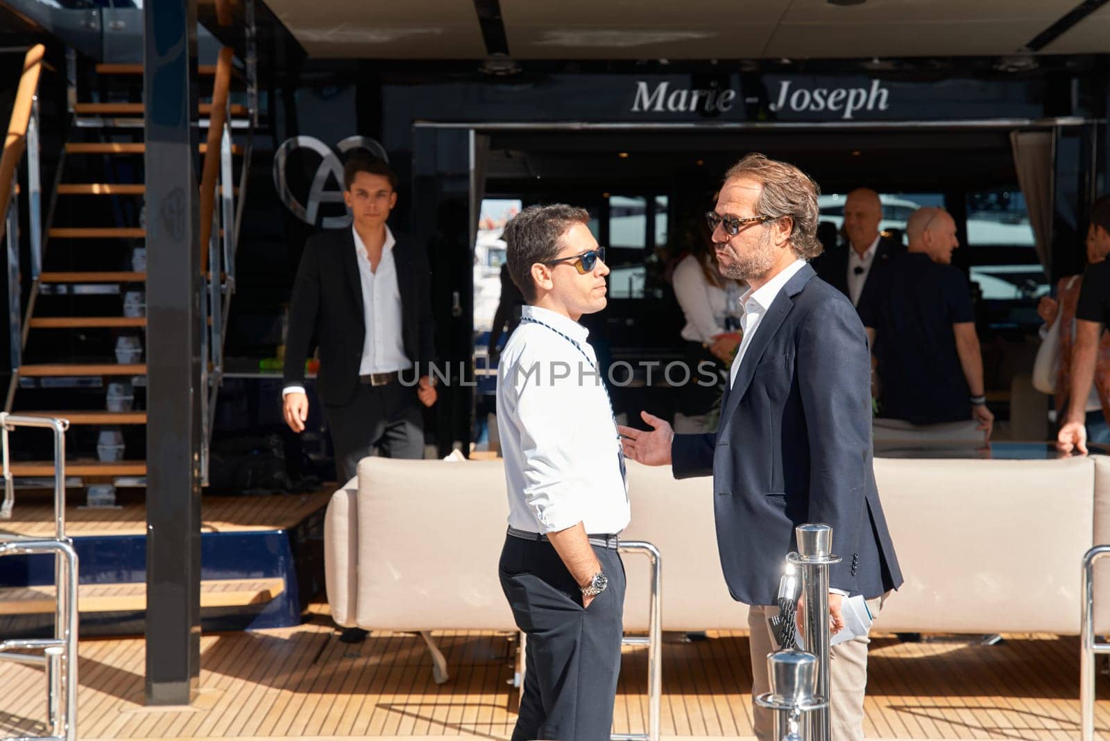 Monaco, Monte Carlo, 29 September 2022 - a lot of people, clients and yacht brokers look at the mega yachts presented, discuss the novelties of the boating industry at the famous motorboat exhibition. High quality photo