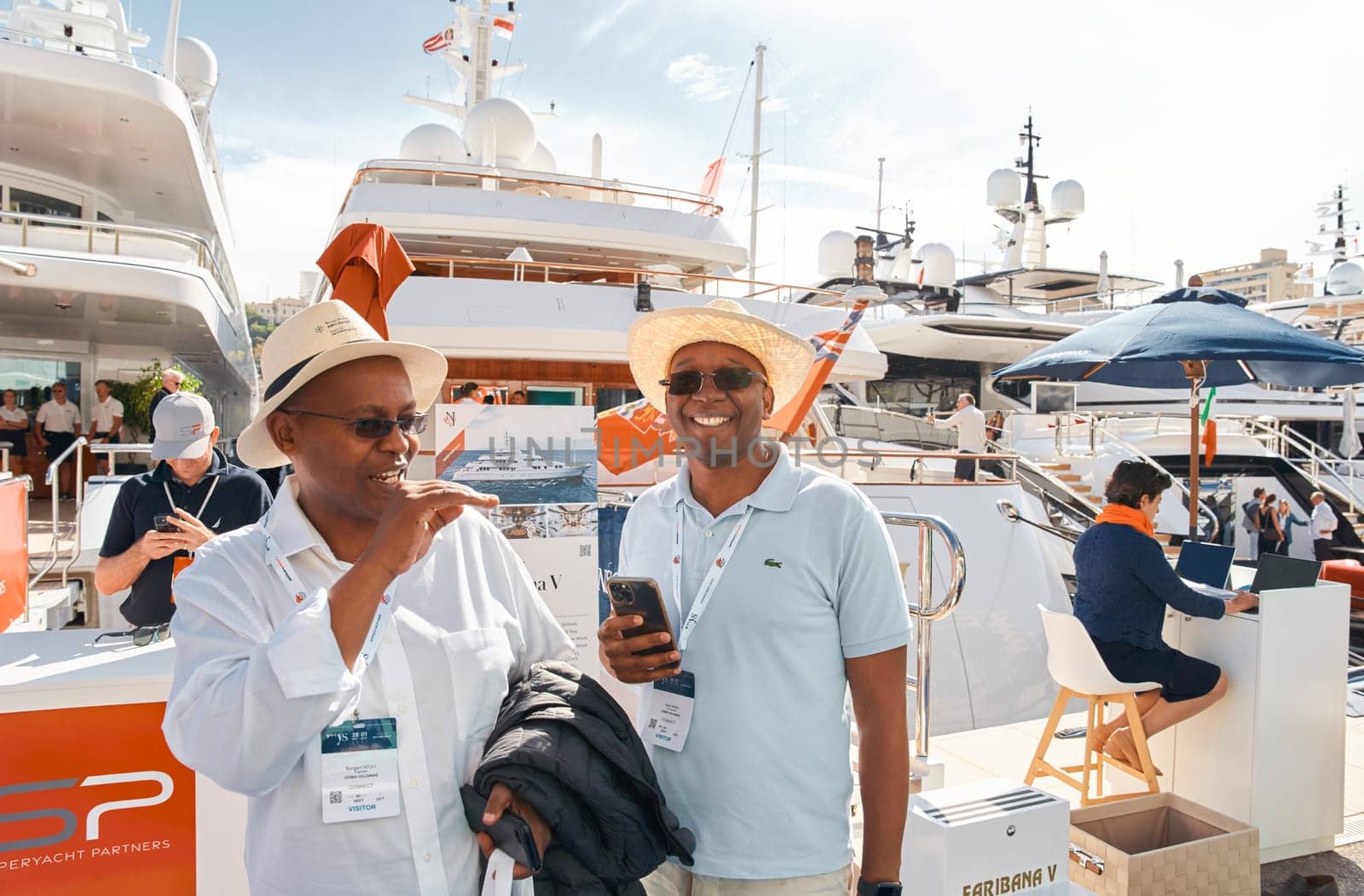 Monaco, Monte Carlo, 29 September 2022 - a lot of people, clients and yacht brokers look at the mega yachts presented, discuss the novelties of the boating industry at the famous motorboat exhibition. High quality photo