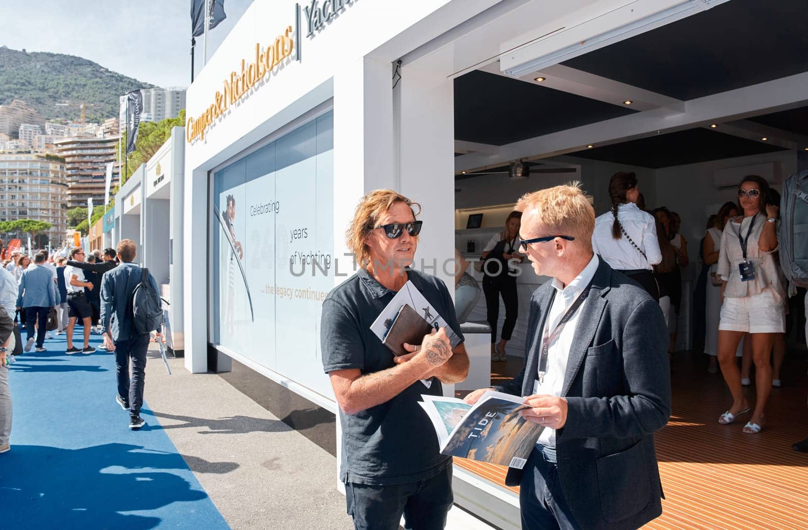 Monaco, Monte Carlo, 29 September 2022 - a lot of people, clients and yacht brokers look at the mega yachts presented, discuss the novelties of the boating industry at the famous motorboat exhibition by vladimirdrozdin