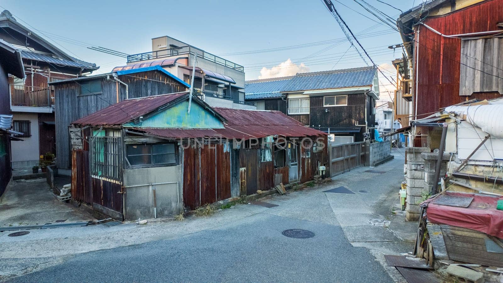 Old house on narrow road in small Japanese town of Iwaya. High quality photo