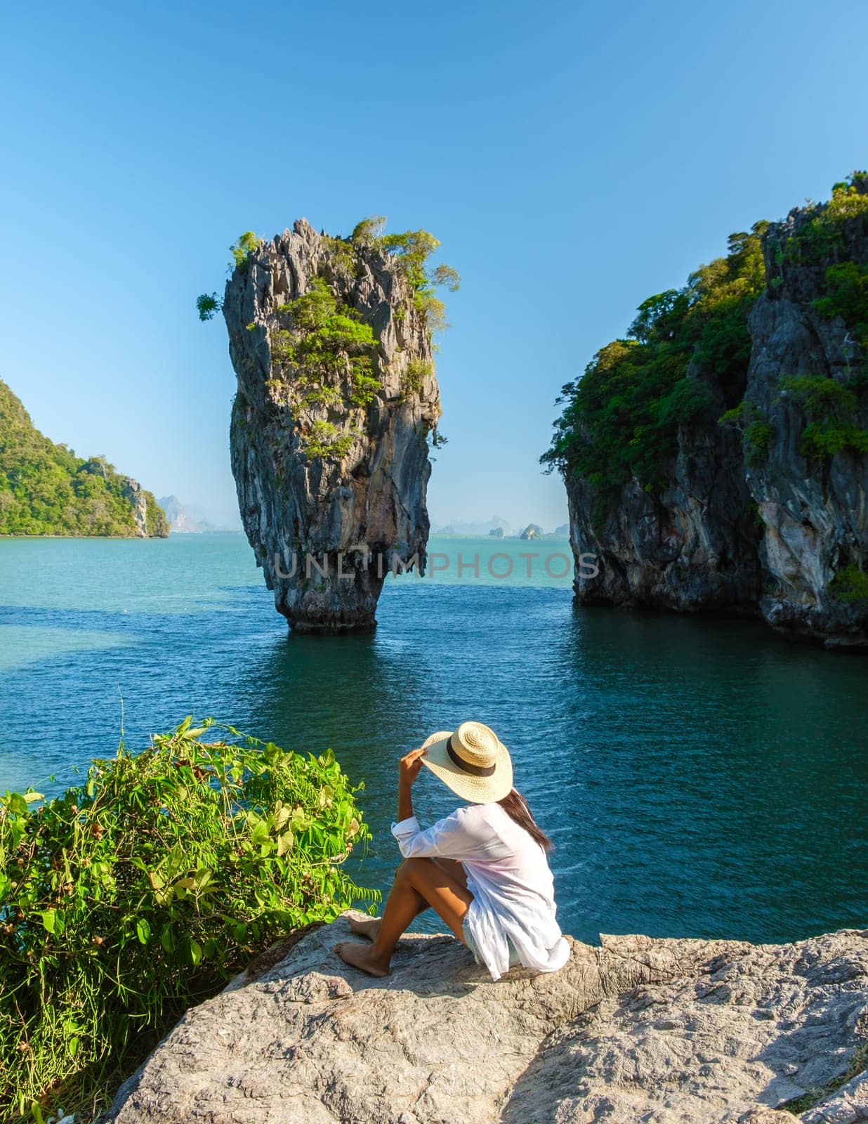 James Bond Island Phangnga Bay Thailand, Asian woman visits the Island near Phuket Thailand, women on a boat trip at Phangnga Bay Thailand