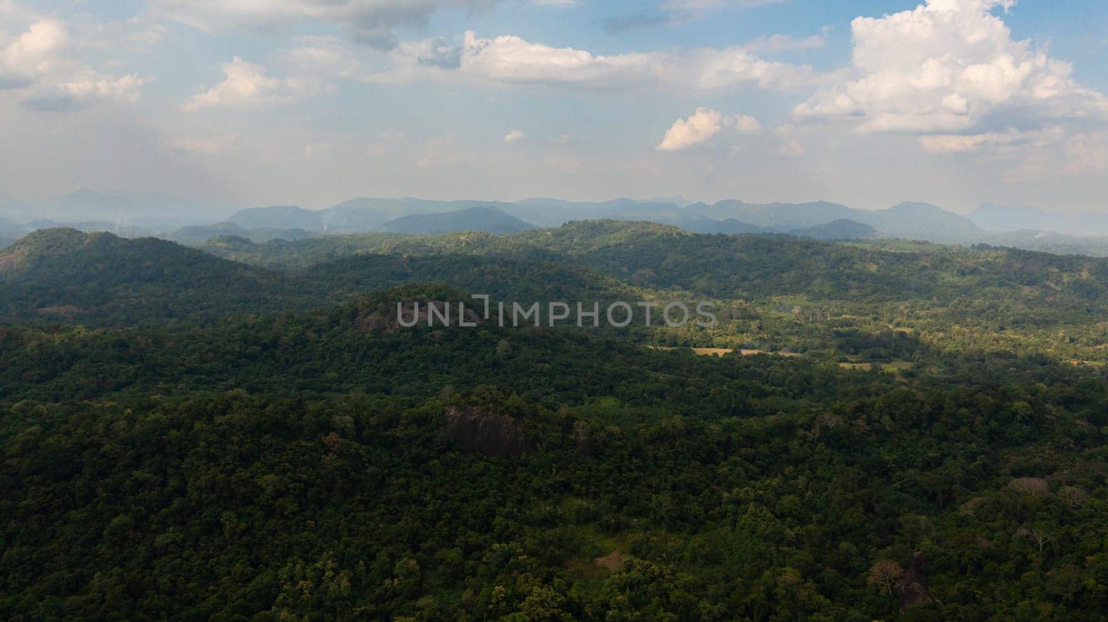 Aerial view of Mountains with rainforest and clouds. Sri Lanka.