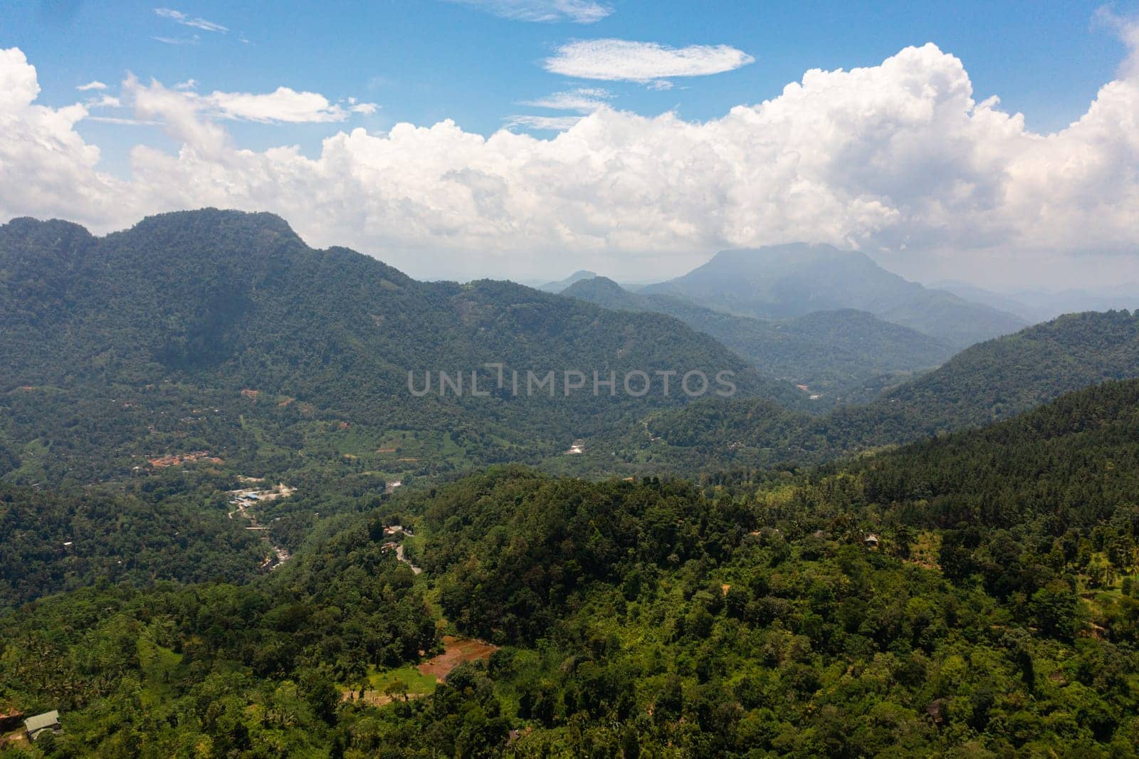 Aerial drone of Mountains with rainforest and jungle in the mountainous province of Sri Lanka.
