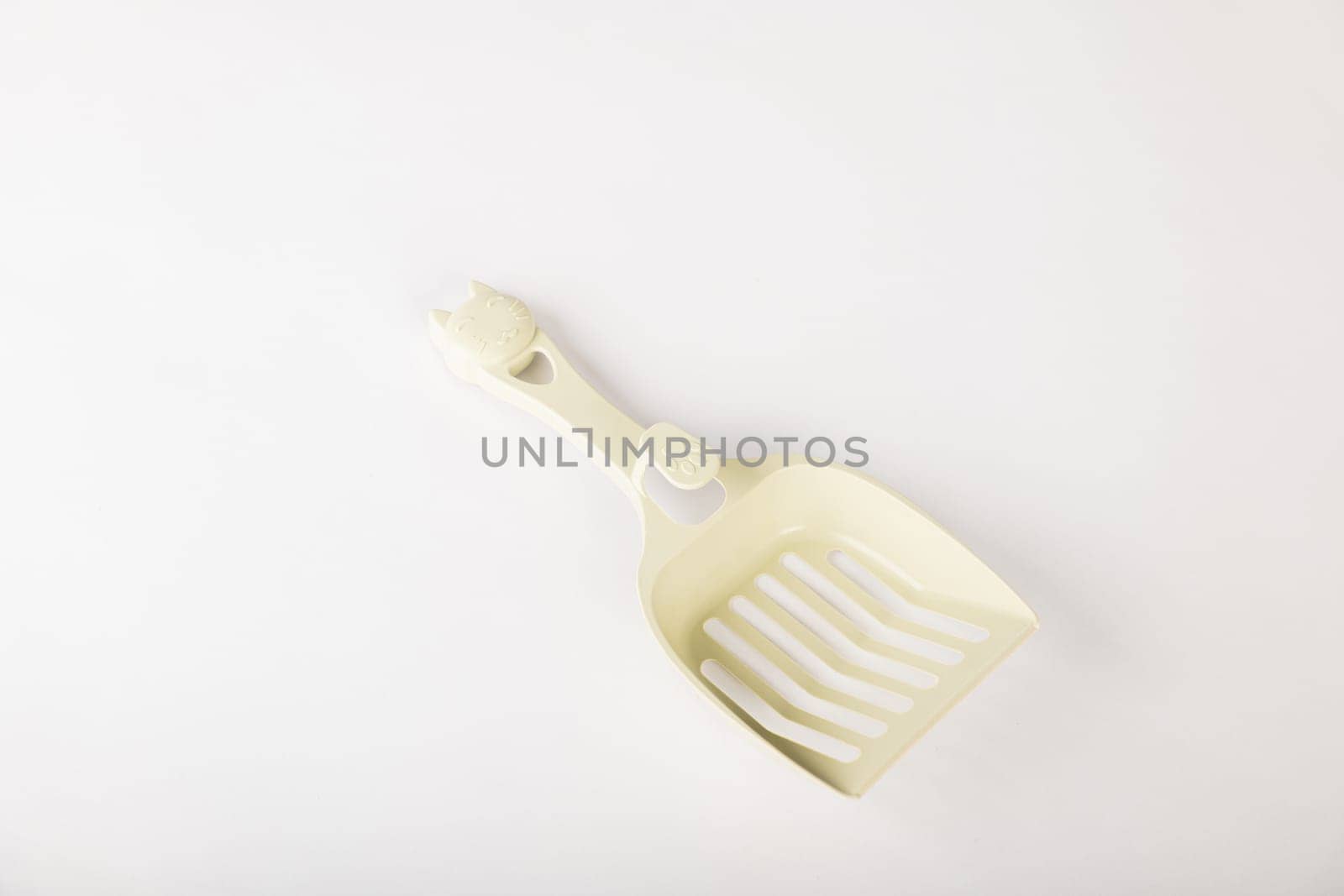 Hygiene and cleanliness are at the forefront with isolated metal cat litter scoops on a white background. Keep your cat's litter box fresh and clean for a happy healthy pet. by Sorapop