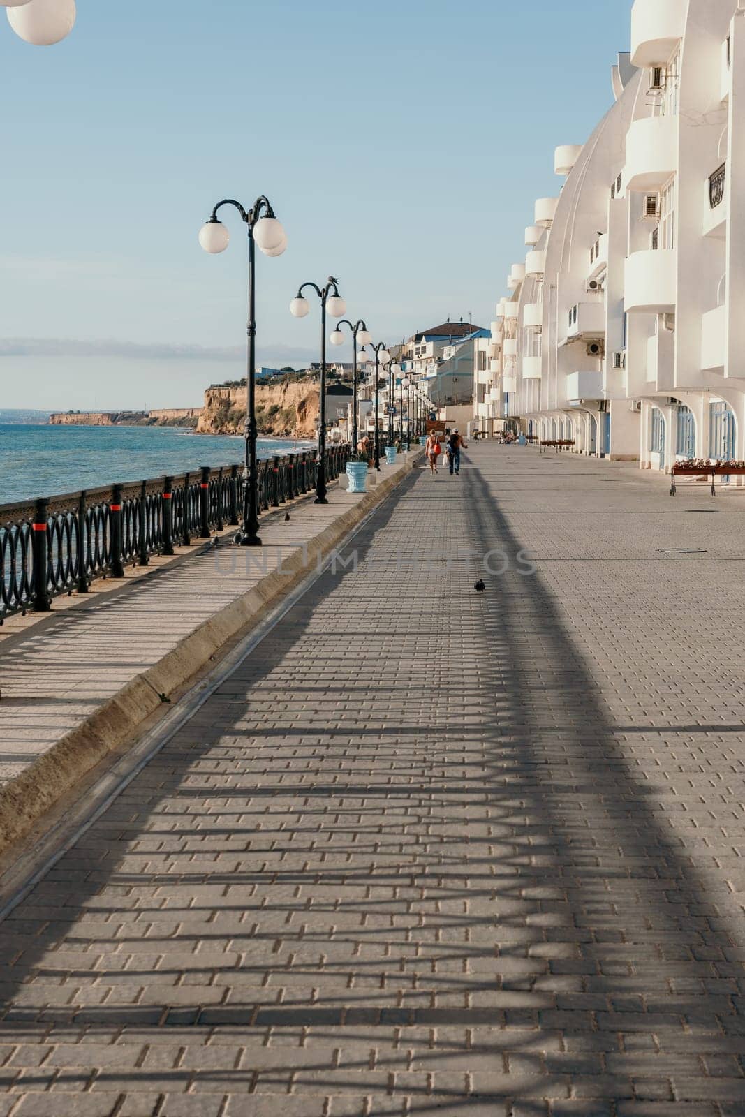 Coastal residential areas with a modern hotel and restaurant complex alongside sandy beaches. Summer holiday vacation and travel concept. by panophotograph