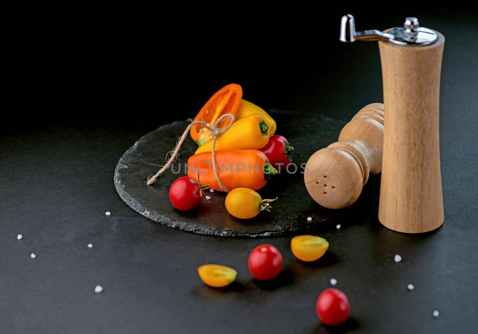 bell peppers, tomatoes and cooking utensils. Different fresh vegetables on countertop in modern kitchen. Space for text by aprilphoto